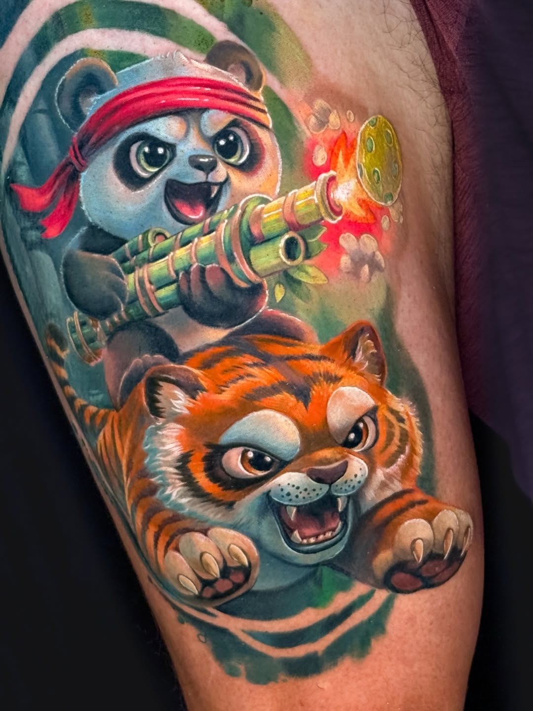 Panda and tiger characters new school tattoo on the forearm by Amy Zager