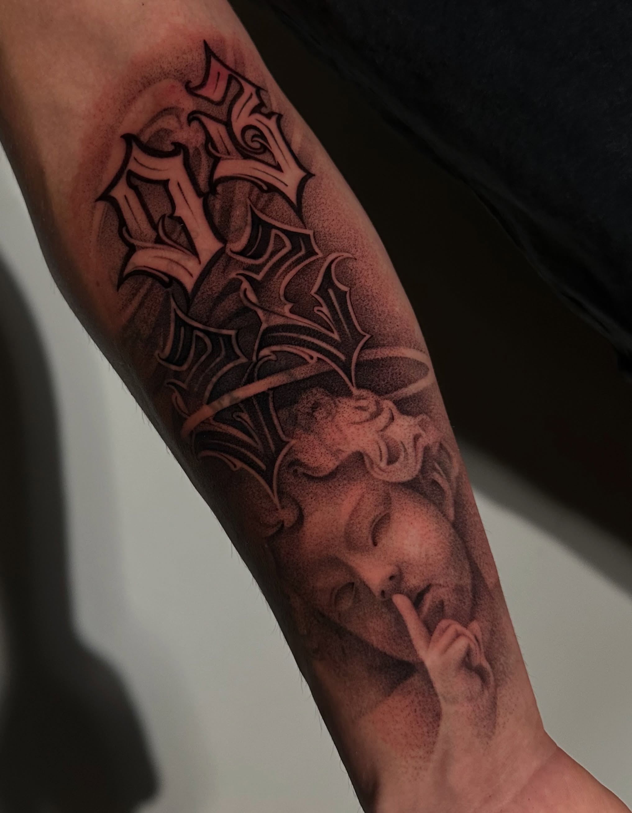 Angel with finger on lips dotwork tattoo on the forearm by ᴰᴿᴬᴳᴼᴺ