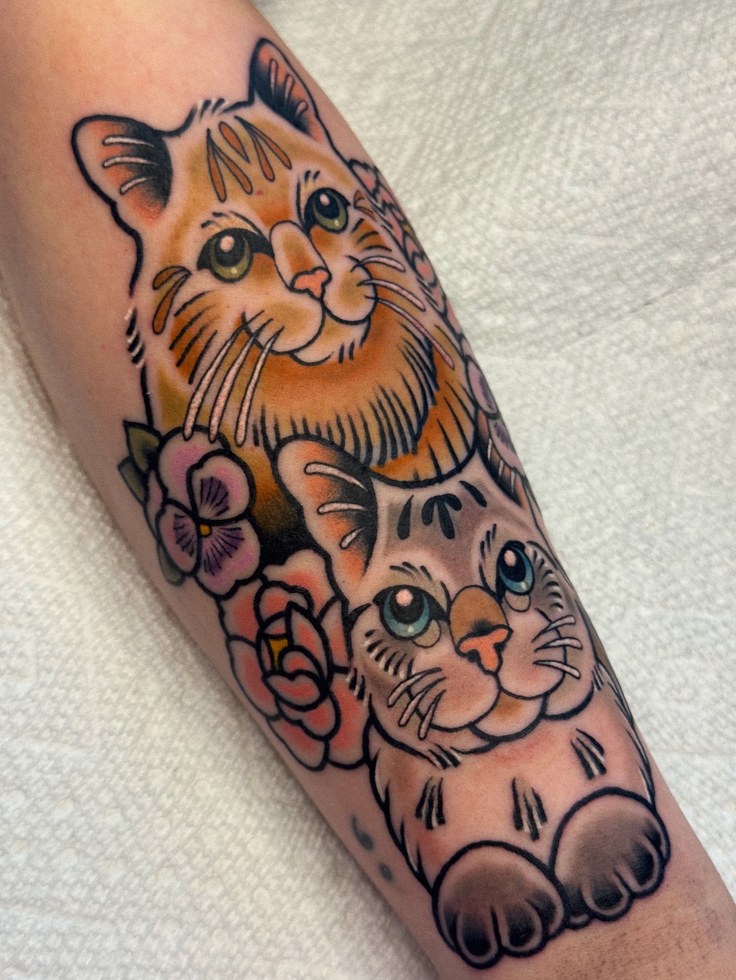 Cats and flowers American traditional tattoo on the forearm by 𝕷𝖆𝖚𝖗 𝕷𝖆𝖚𝖗