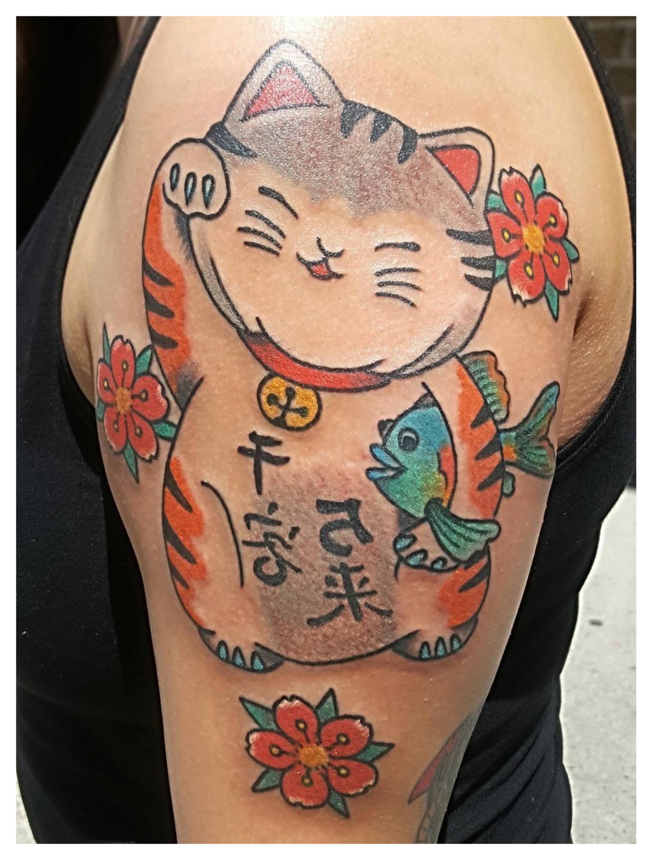 Maneki-neko with fish American traditional tattoo on the shoulder by joe martinez, Denver, Colorado