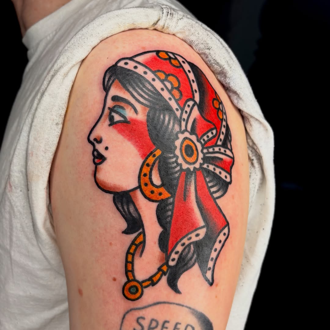 Woman with headdress American traditional tattoo on the shoulder by Braedon 🎱