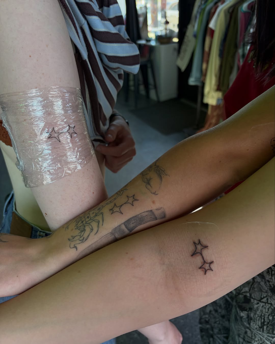 Stars black and grey tattoo on the forearm by Daniela