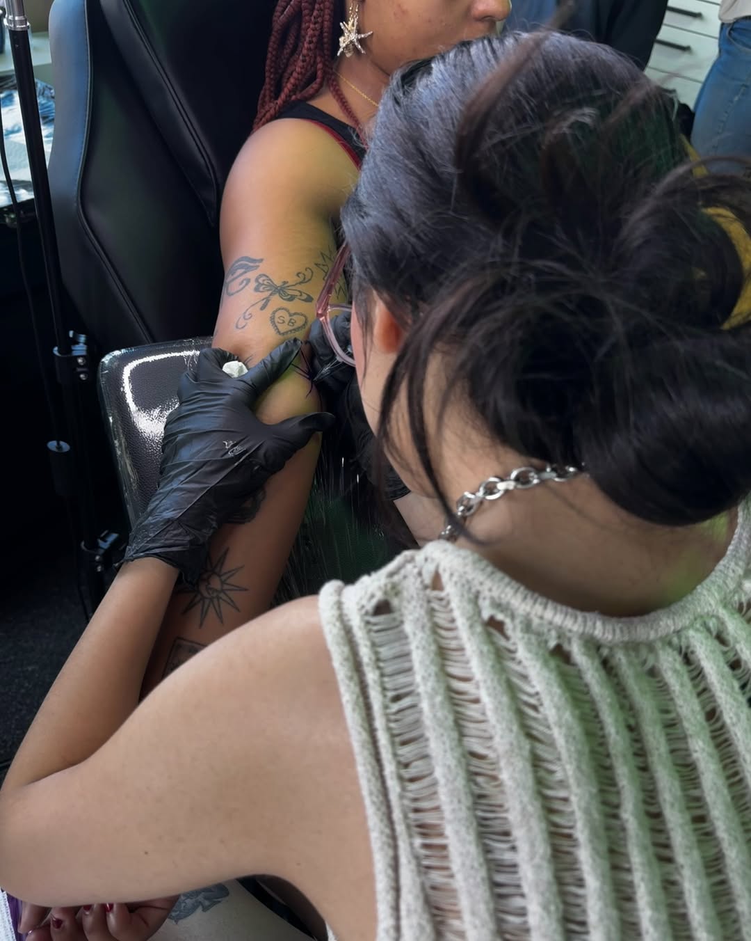 Floral design black and grey tattoo on the upper arm by Daniela