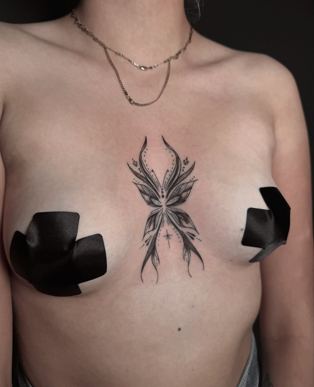 Fairy dotwork tattoo on the chest by Alex Cantor