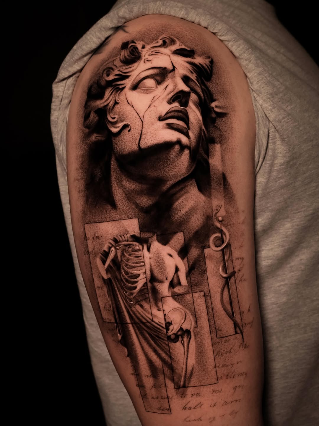 Classical sculpture and anatomical study surrealism tattoo on the shoulder by Nikita Grinenko, San Francisco