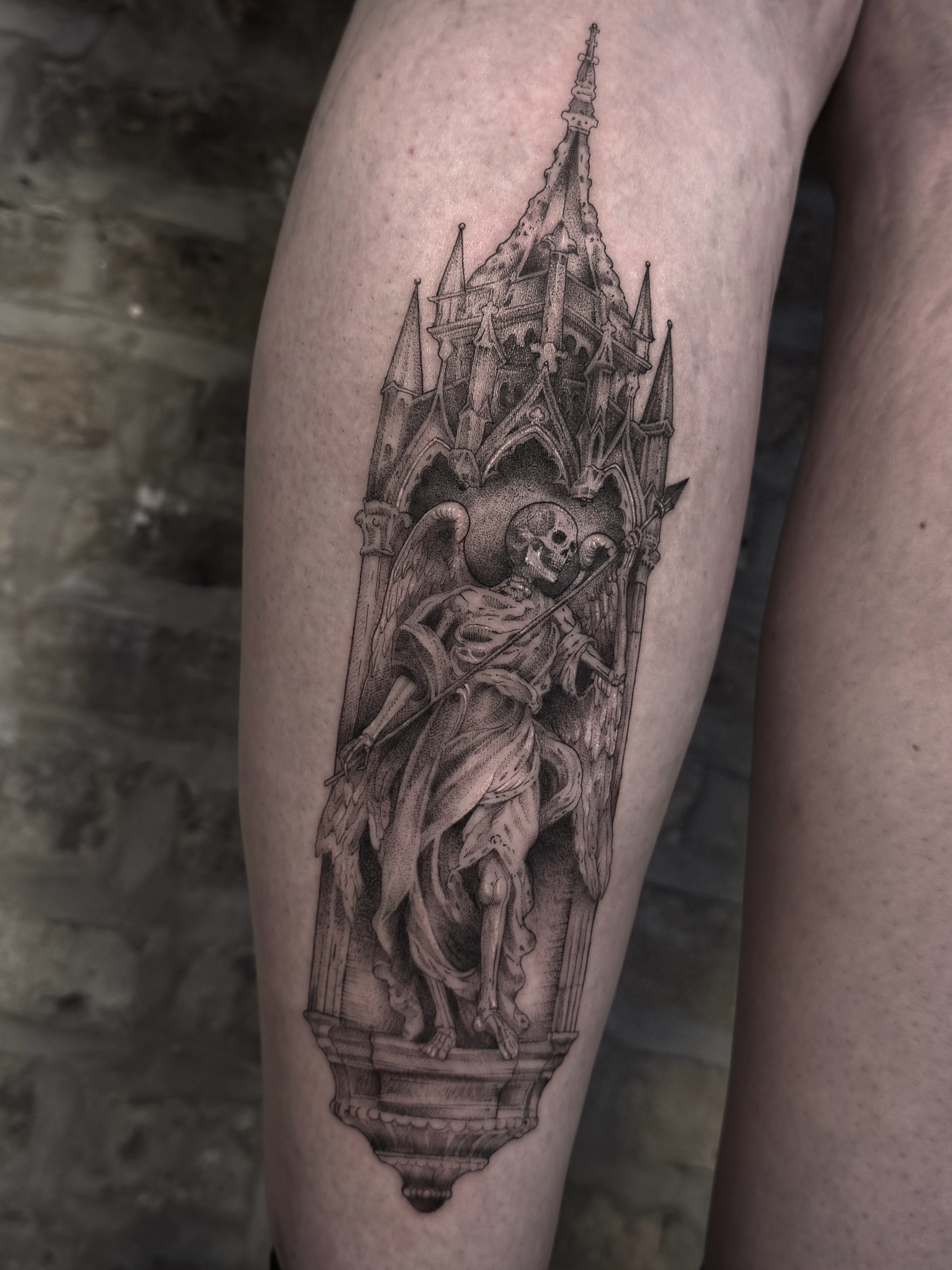 Skeleton and cathedral realism tattoo on the thigh by Tattoo Yulia Kononenko