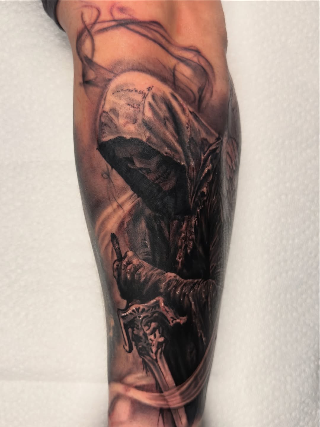 Grim reaper with sword realism tattoo on the forearm by Justin Hay