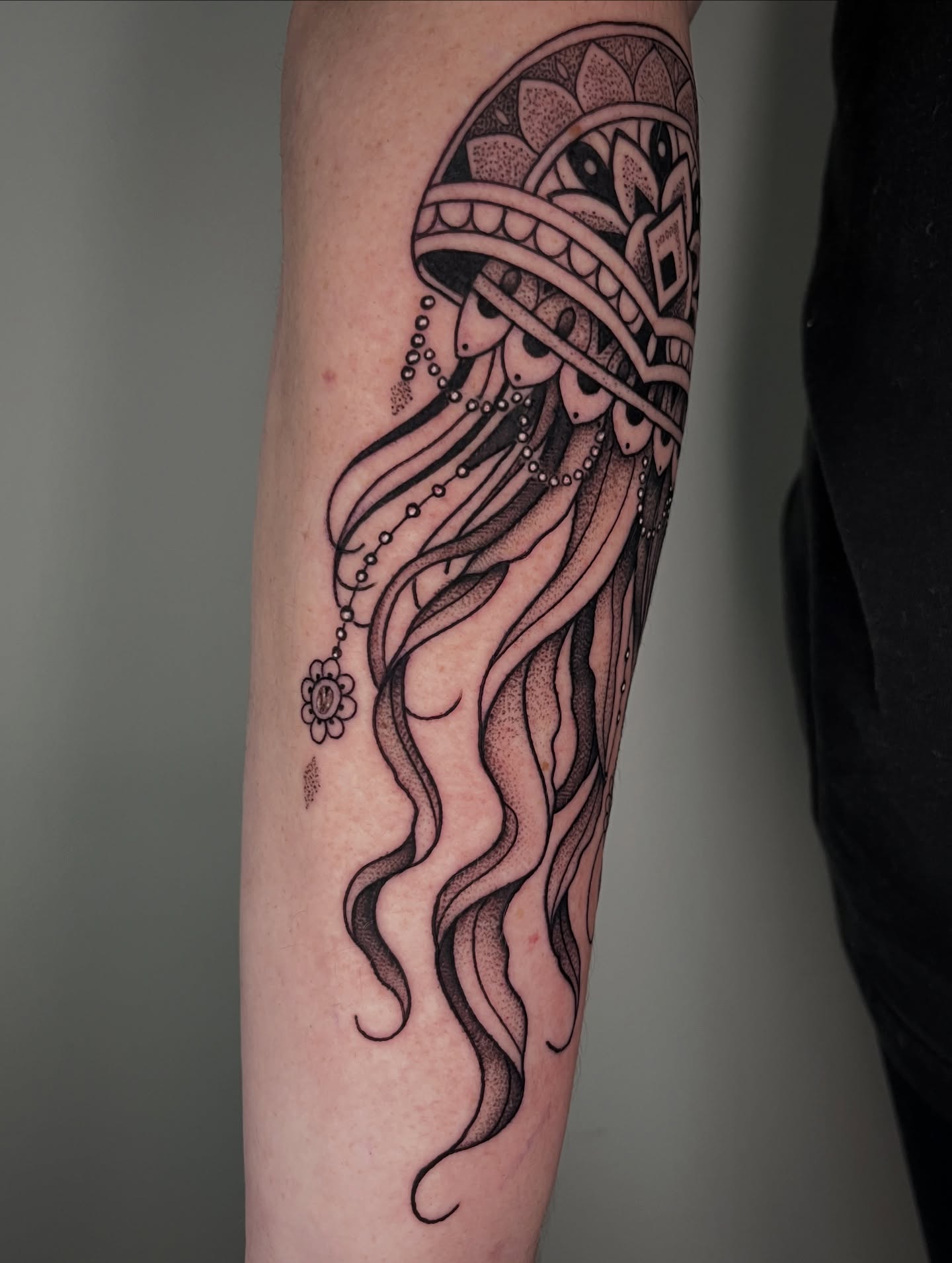 Mermaid dotwork tattoo on the forearm by Jordan Hunt