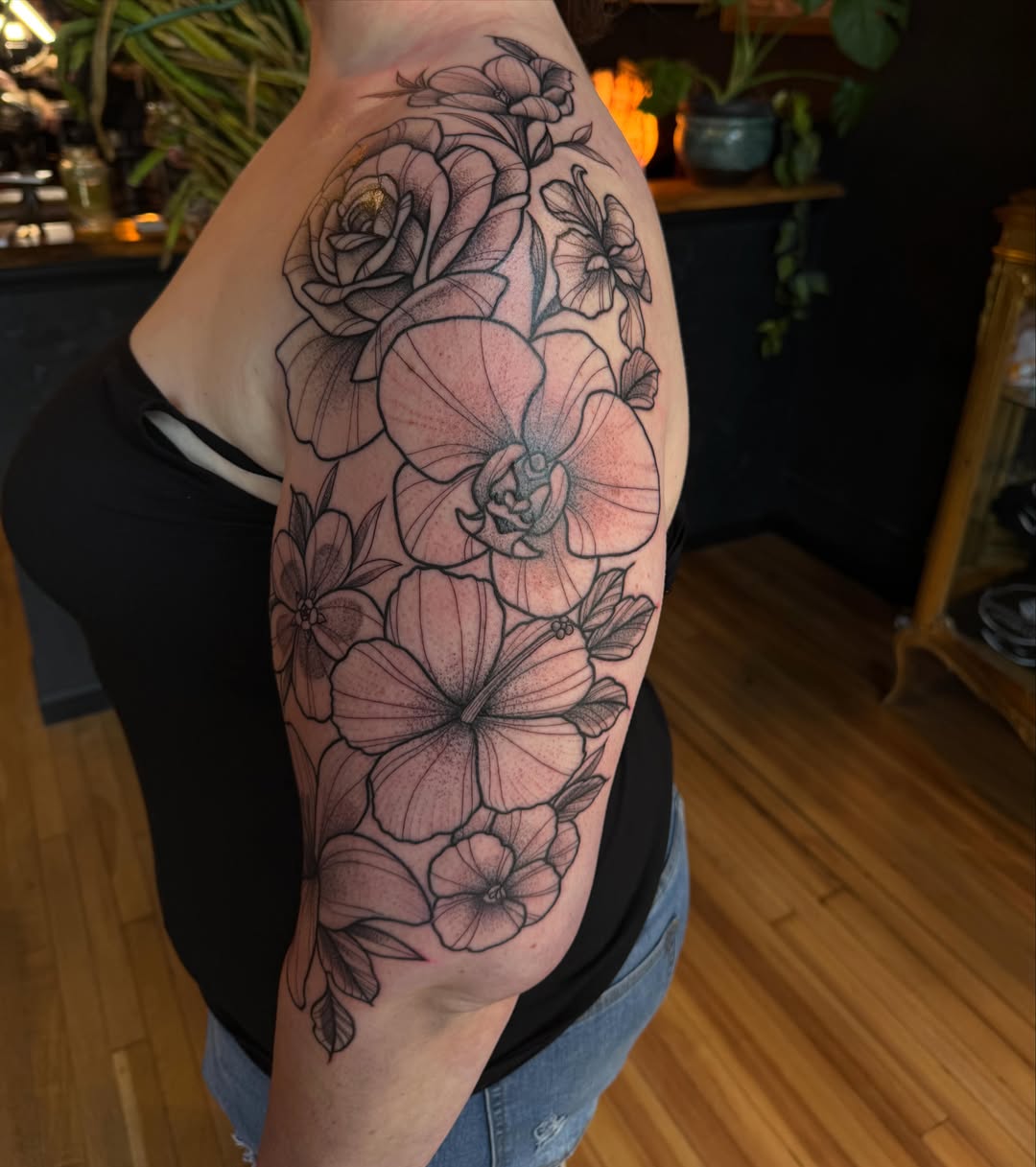 Floral bouquet realism tattoo on the forearm by Allison