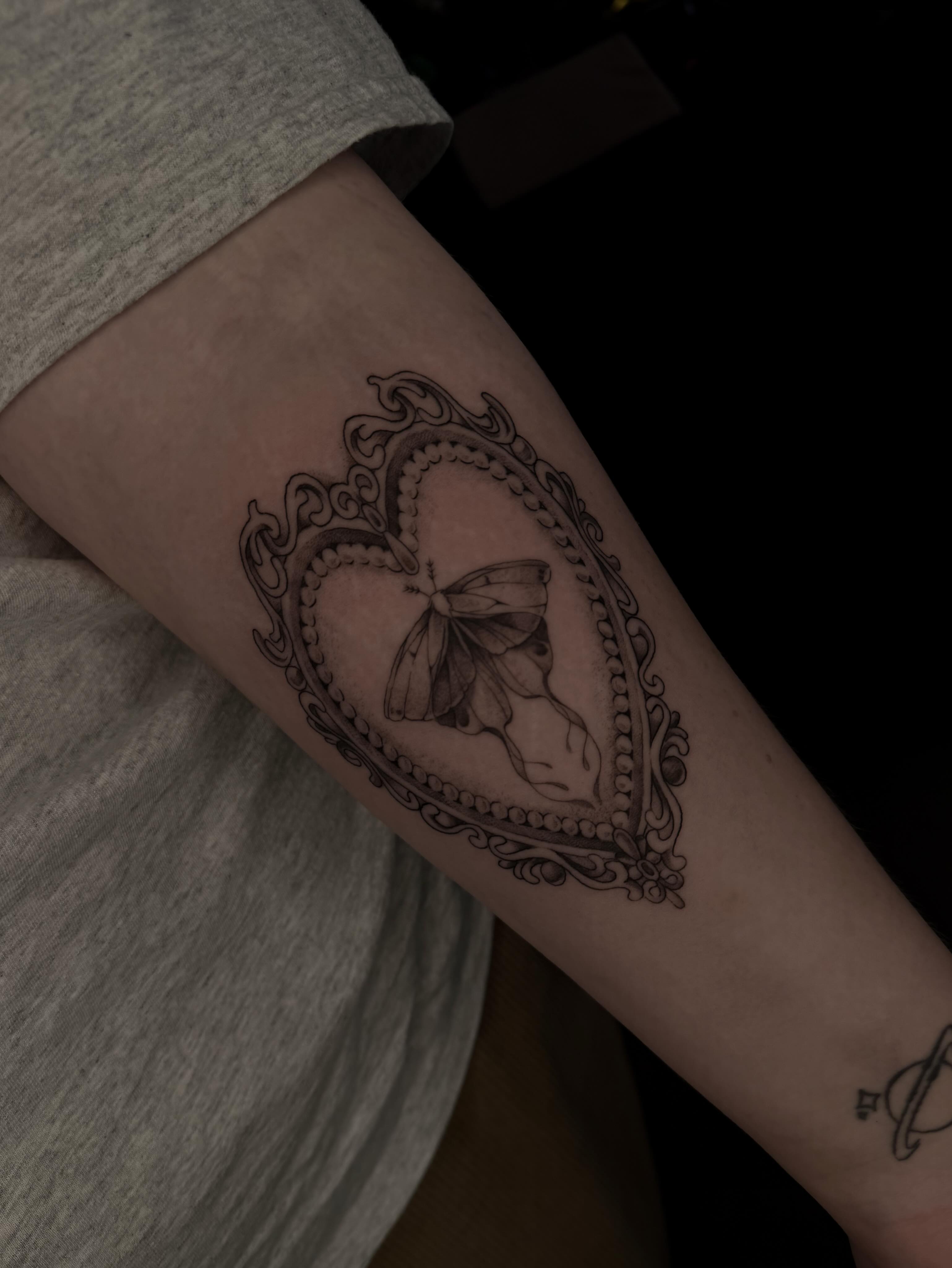 Heart with butterfly ornamental tattoo on the forearm by Susie Maj