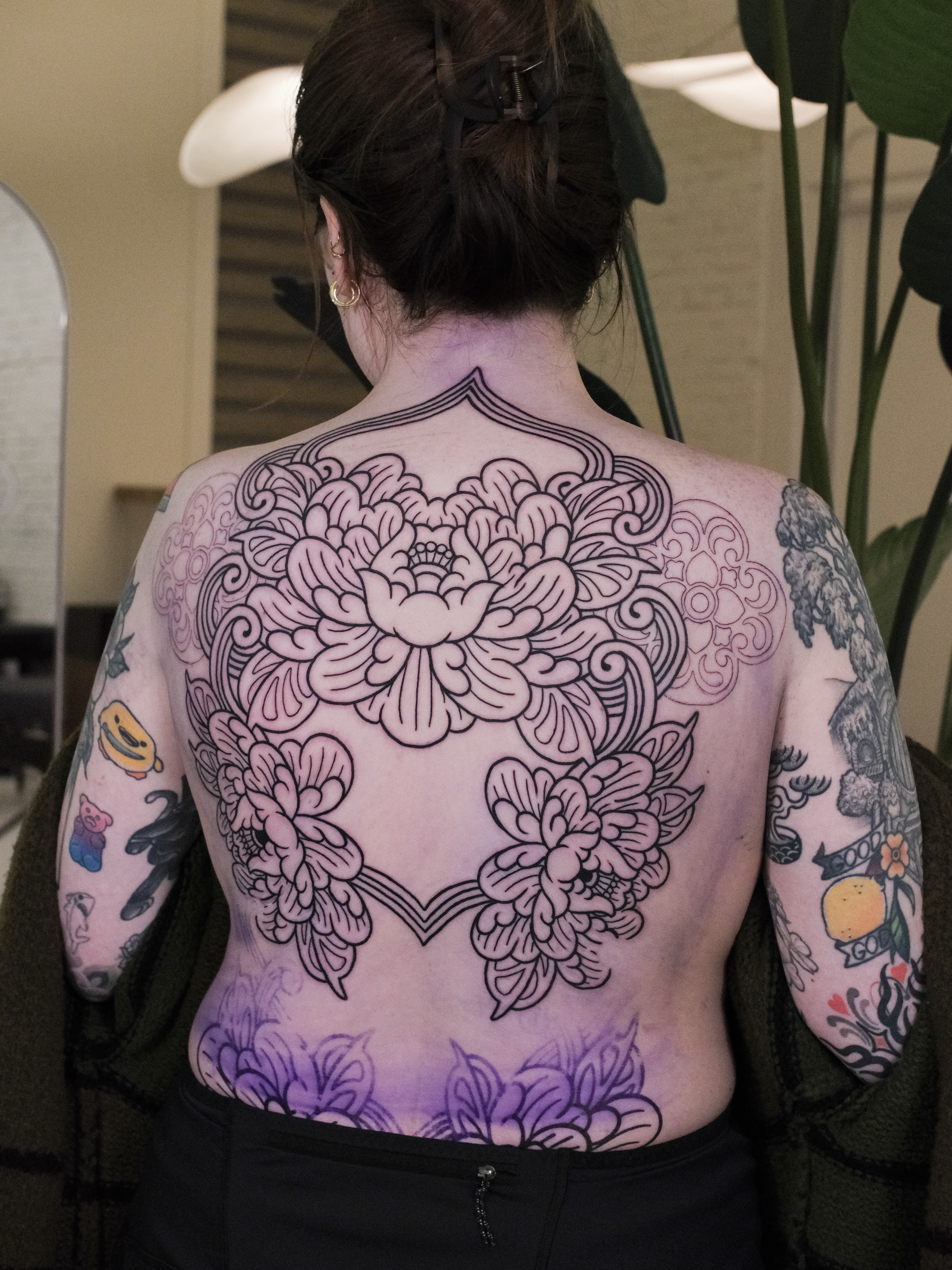 Floral mandala ornamental tattoo on the back by seattle tattoo artist