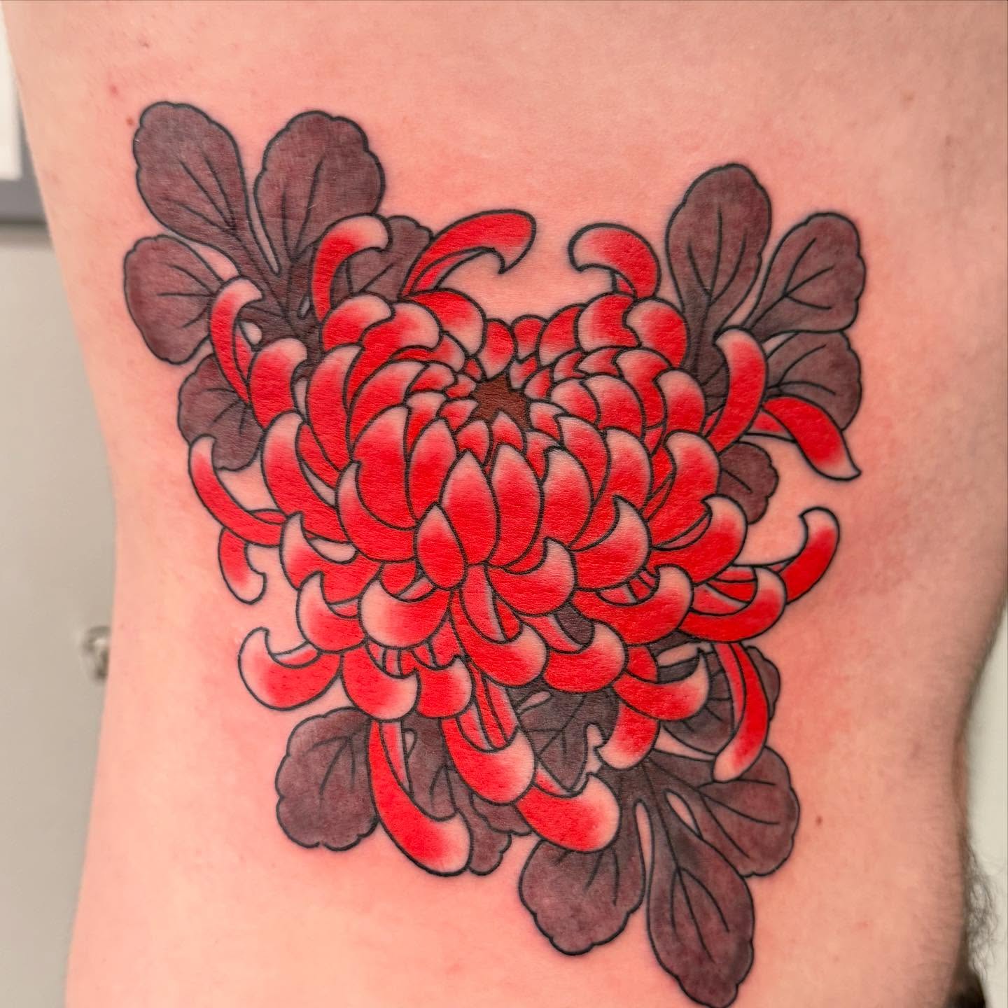 Chrysanthemum japanese irezumi tattoo on the thigh by Jason Eisenberg