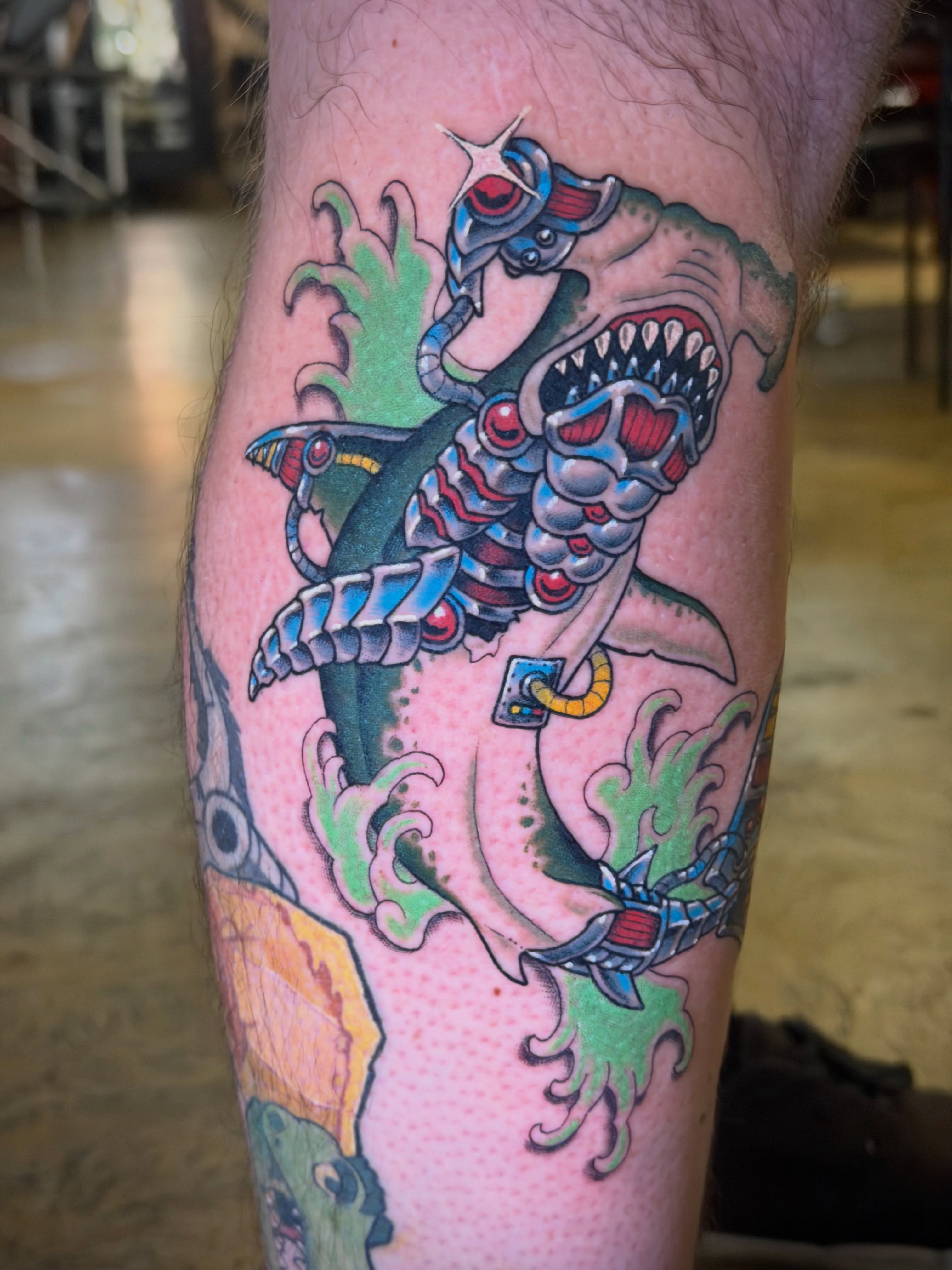 Robot shark American traditional tattoo on the thigh by Thad Collis