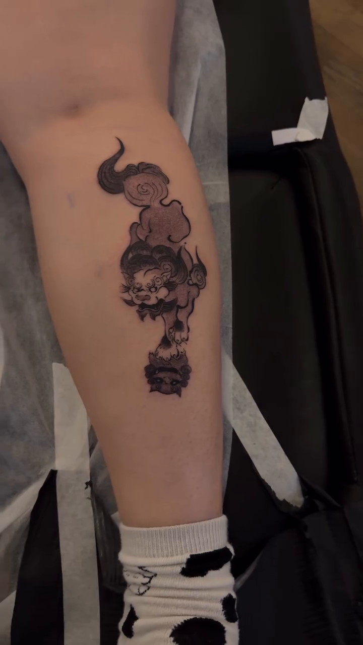 Dragon and clouds realism tattoo on the forearm by Piao
