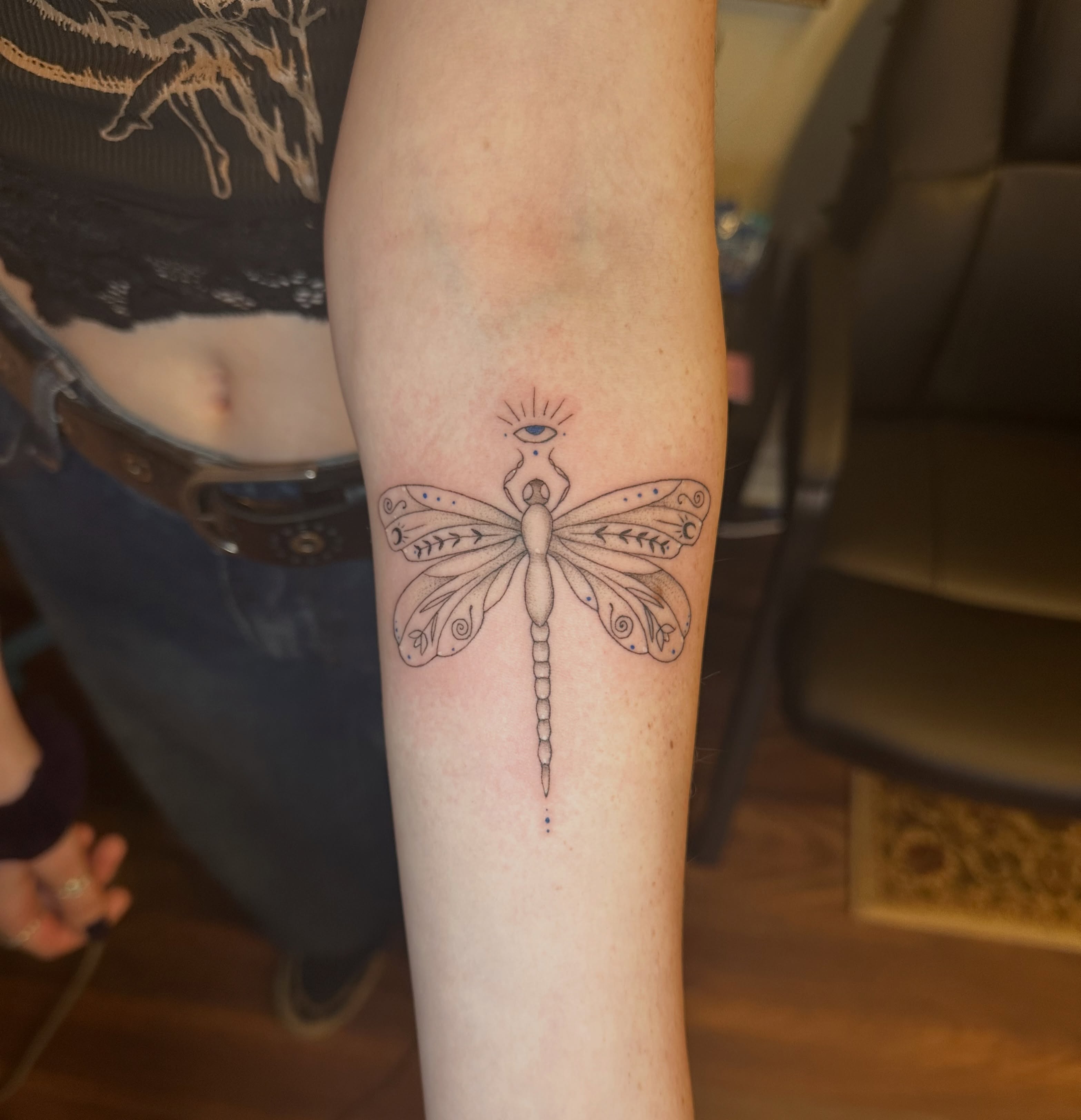 Dragonfly dotwork tattoo on the forearm by Lauren