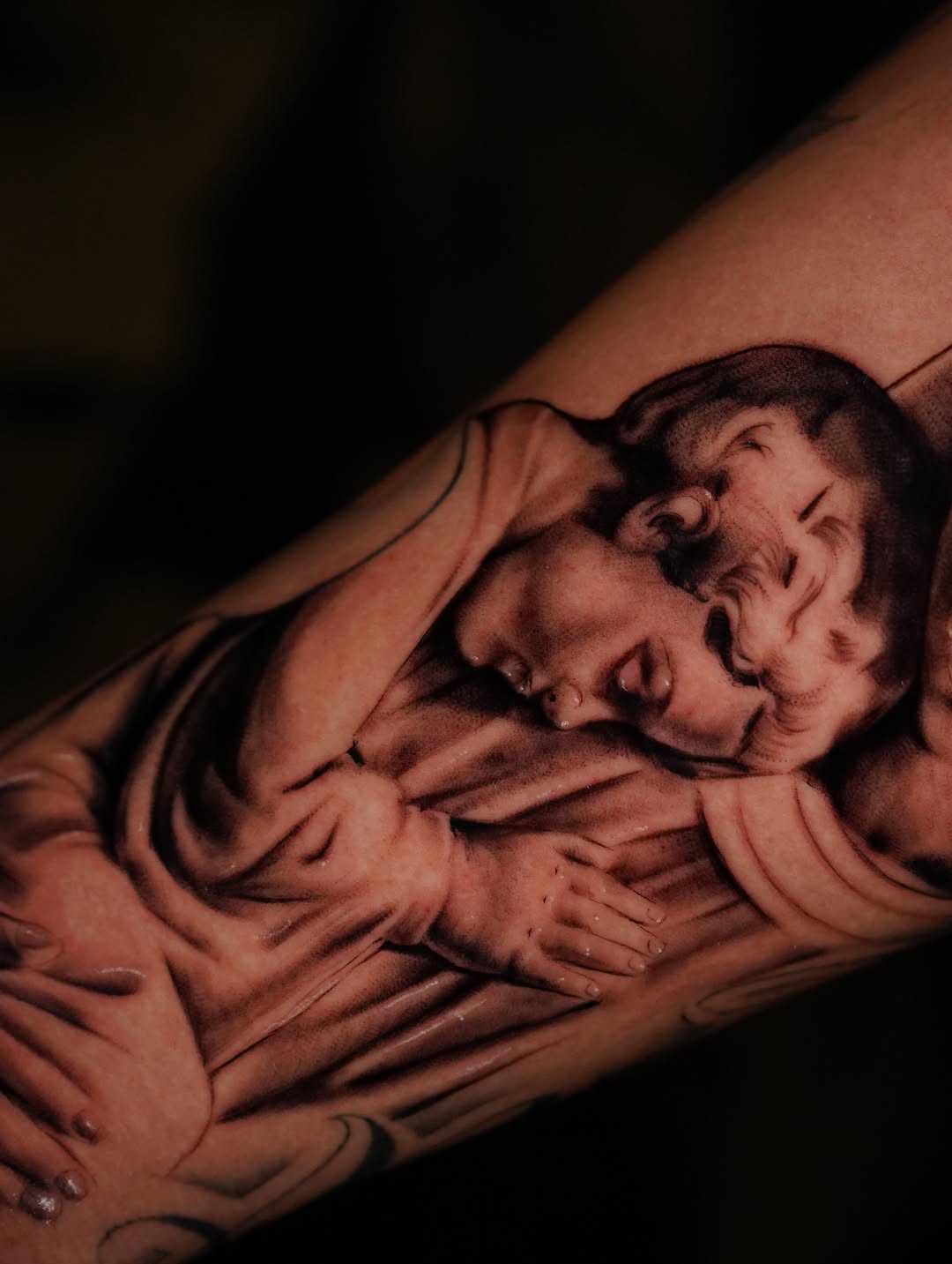 Sleeping baby realism tattoo on the forearm by Jennifer Garcia