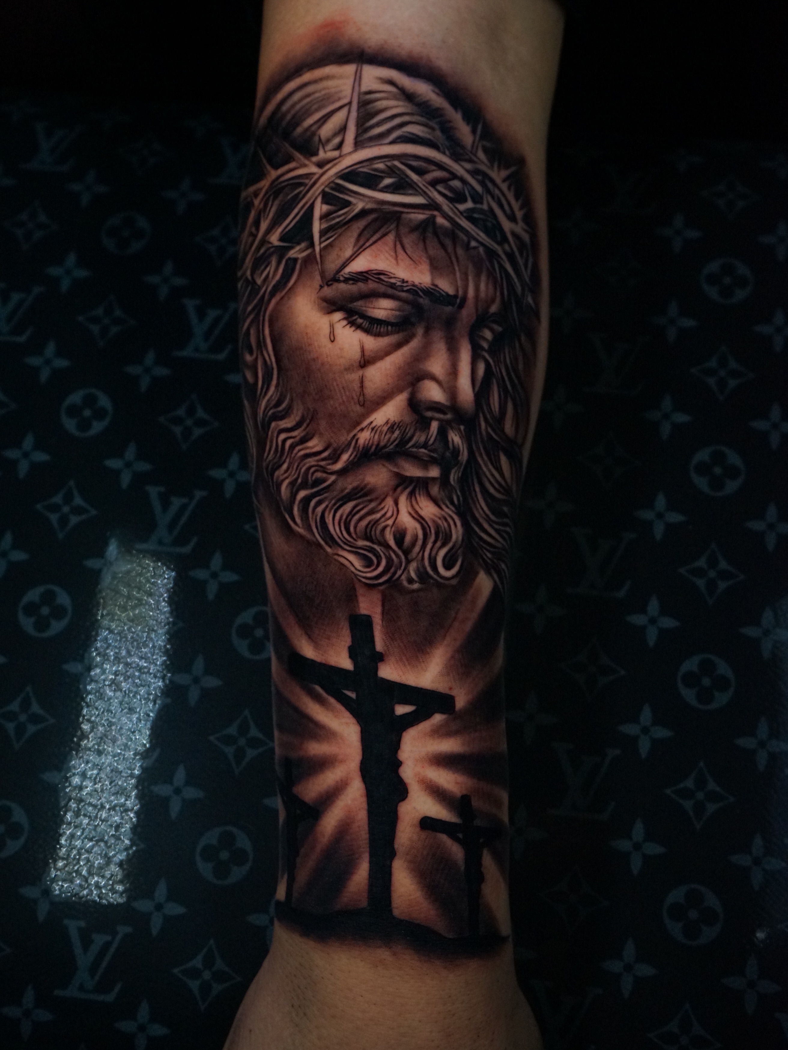 Religious figure realism tattoo on the forearm by Aaron Saenz jr