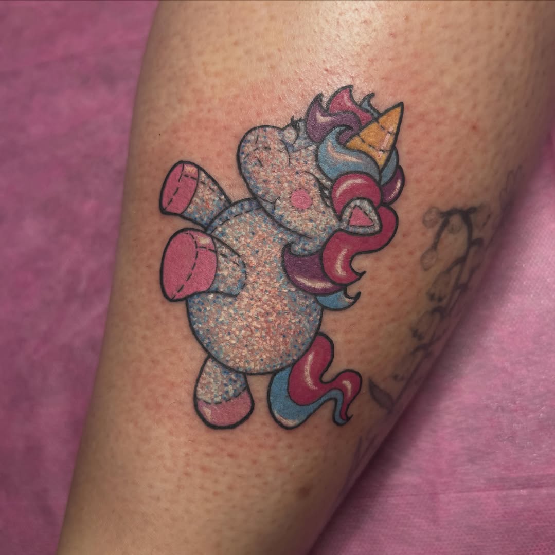 Unicorn new school tattoo on the forearm by Jada Reynolds