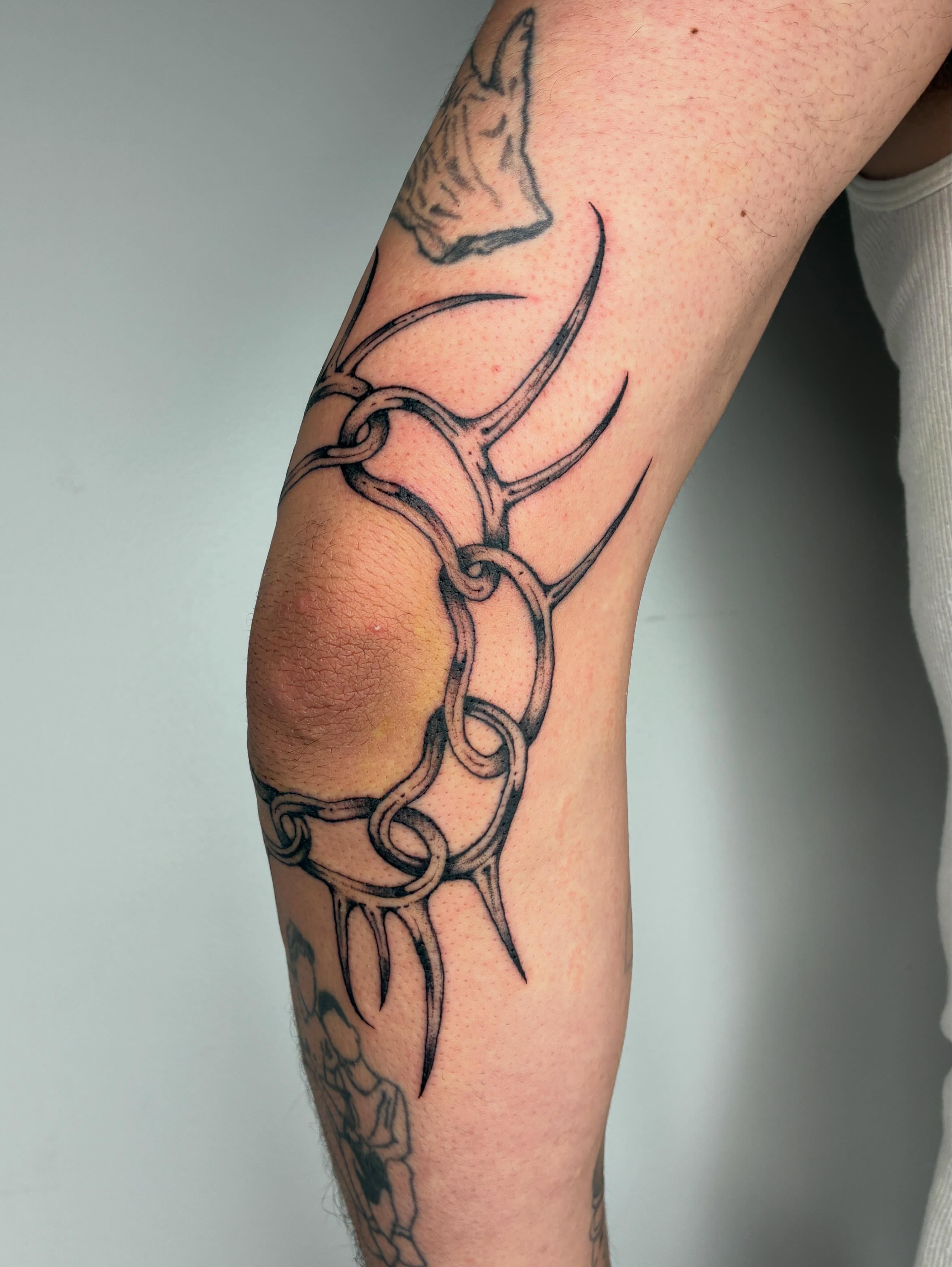 Antlers black and grey tattoo on the forearm by Steven Sessler, San Francisco, California