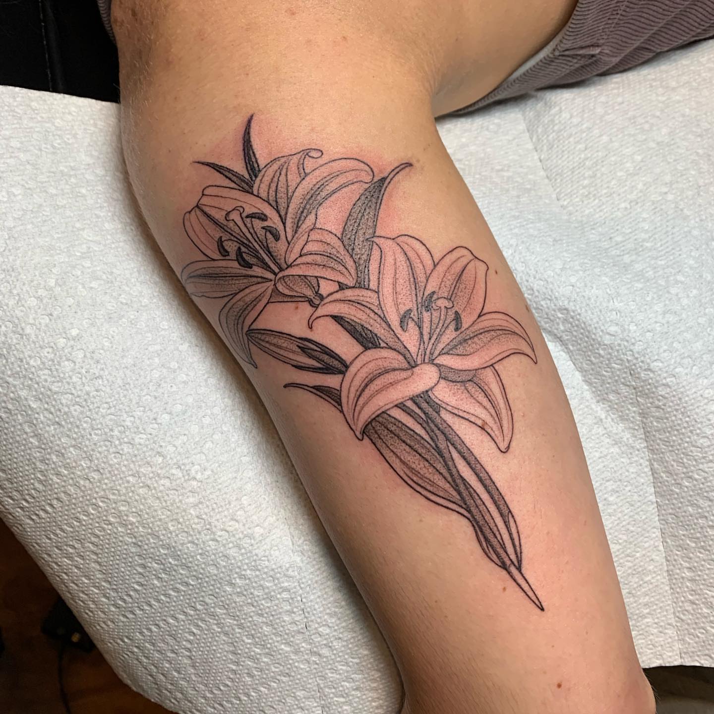 Lilies dotwork tattoo on the forearm by Tabby Wirebach, Kutztown, Pennsylvania