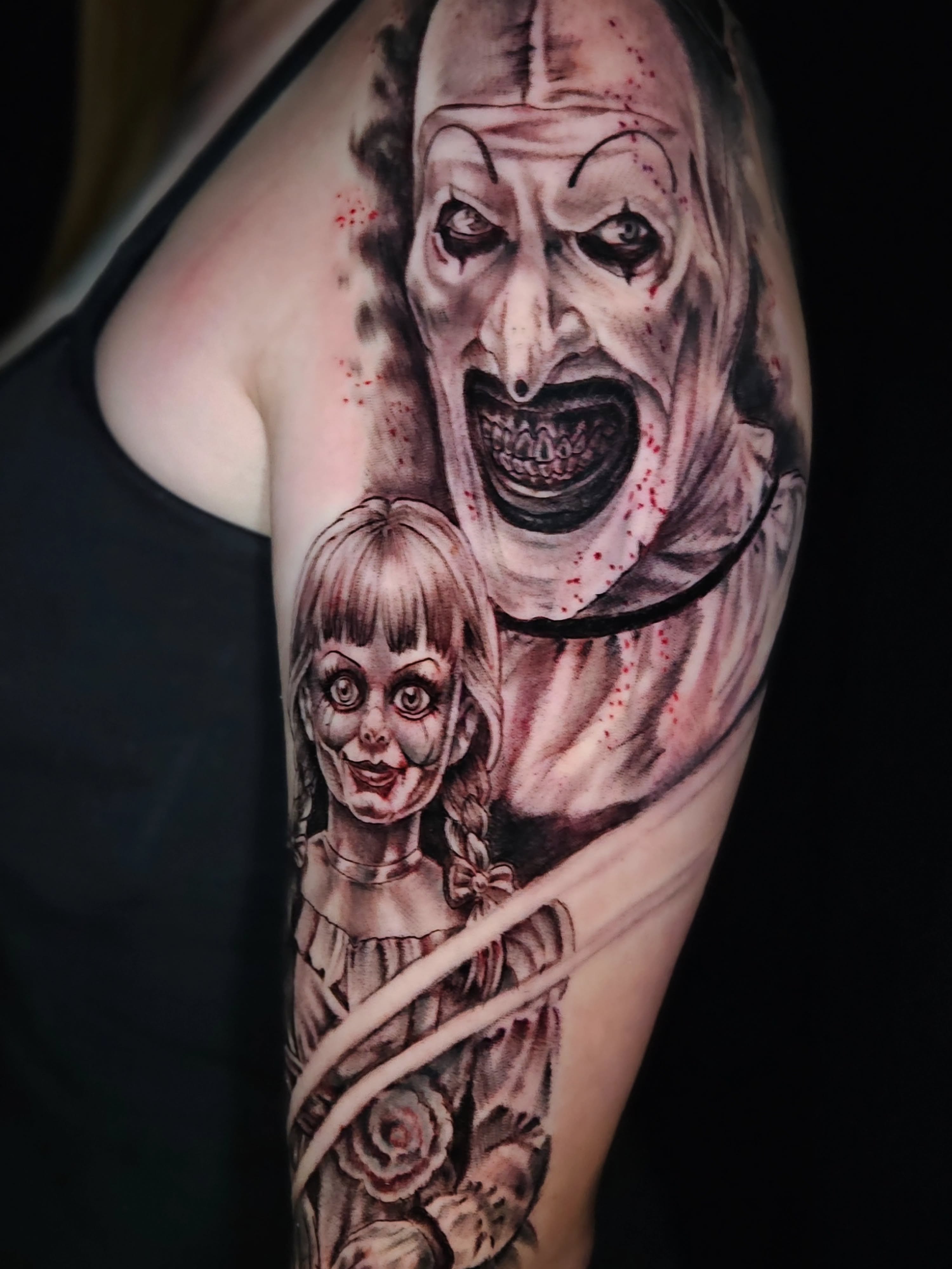Annabelle and demon realism tattoo on the upper arm by Jo'el Acoba