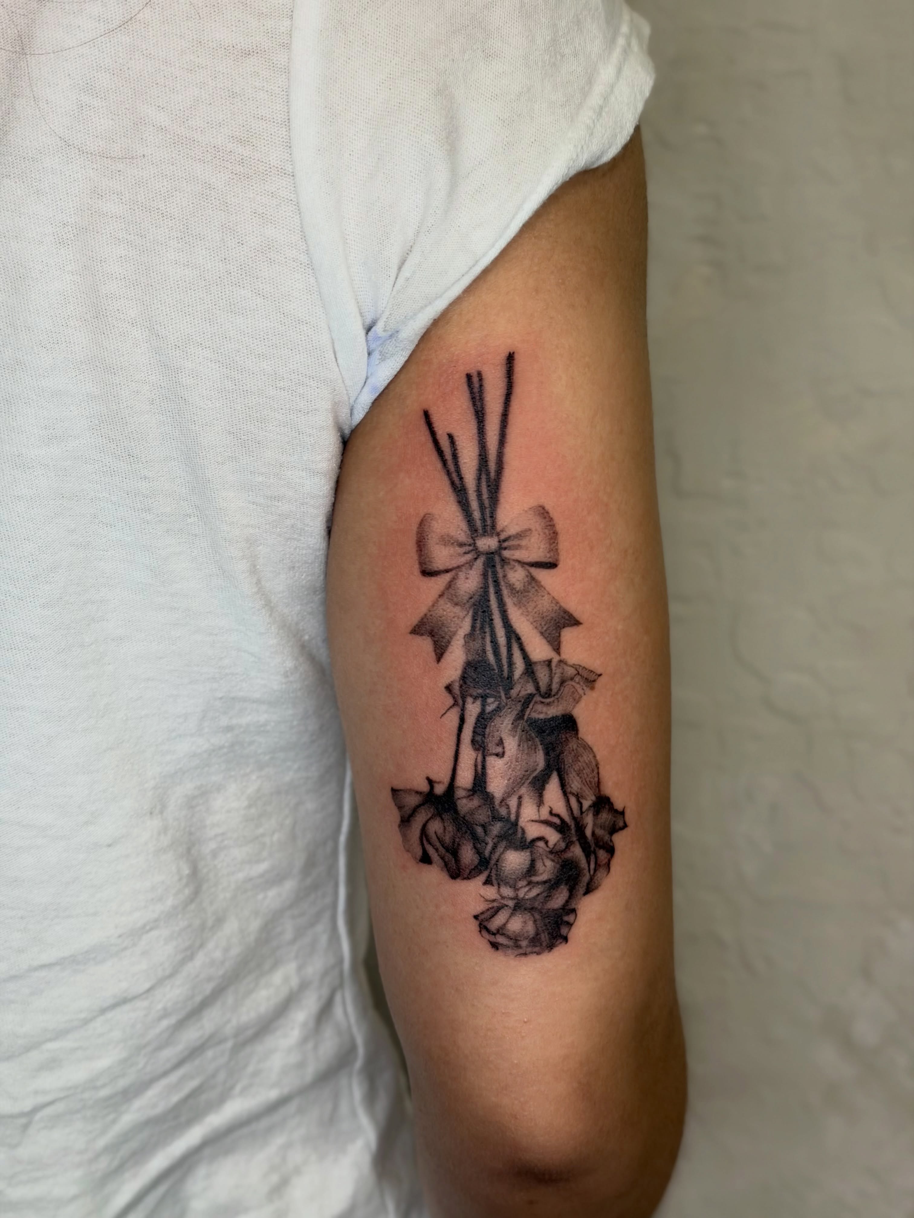 Cross with ribbon black and grey tattoo on the forearm by Bryan Nguyen