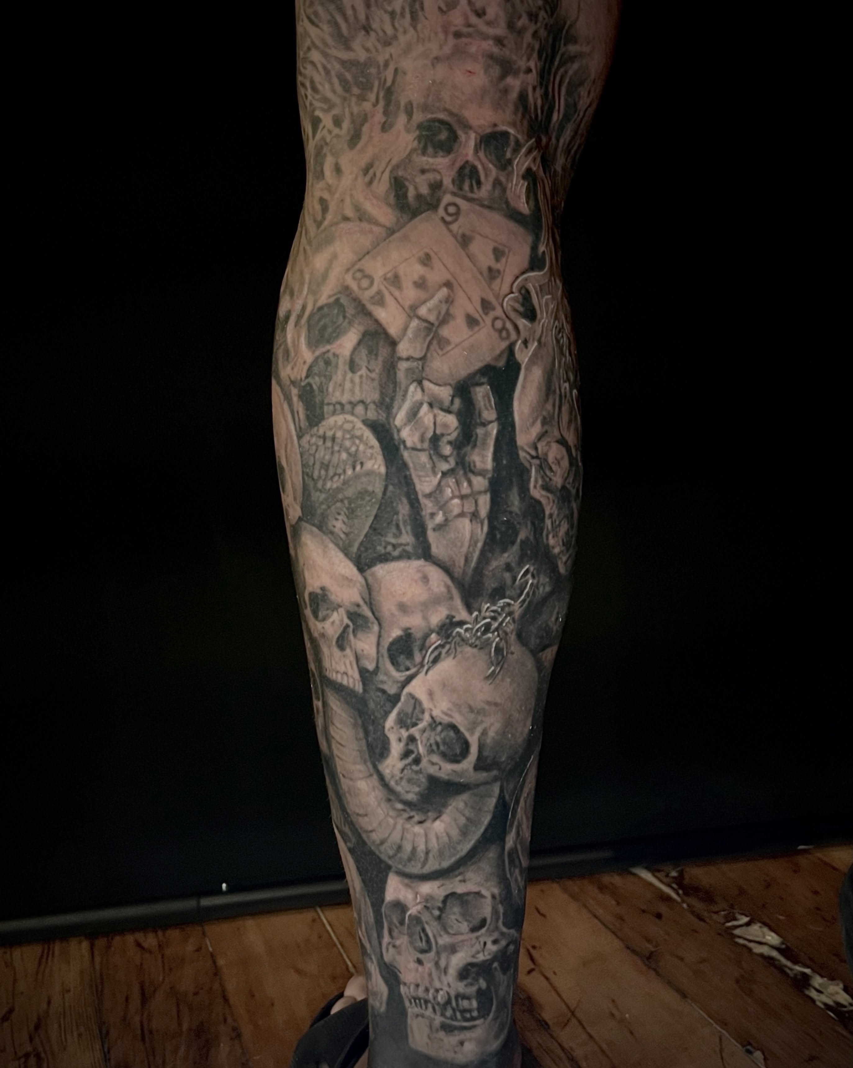 Skulls and playing cards realism tattoo on the forearm by EO, Chicago, Illinois