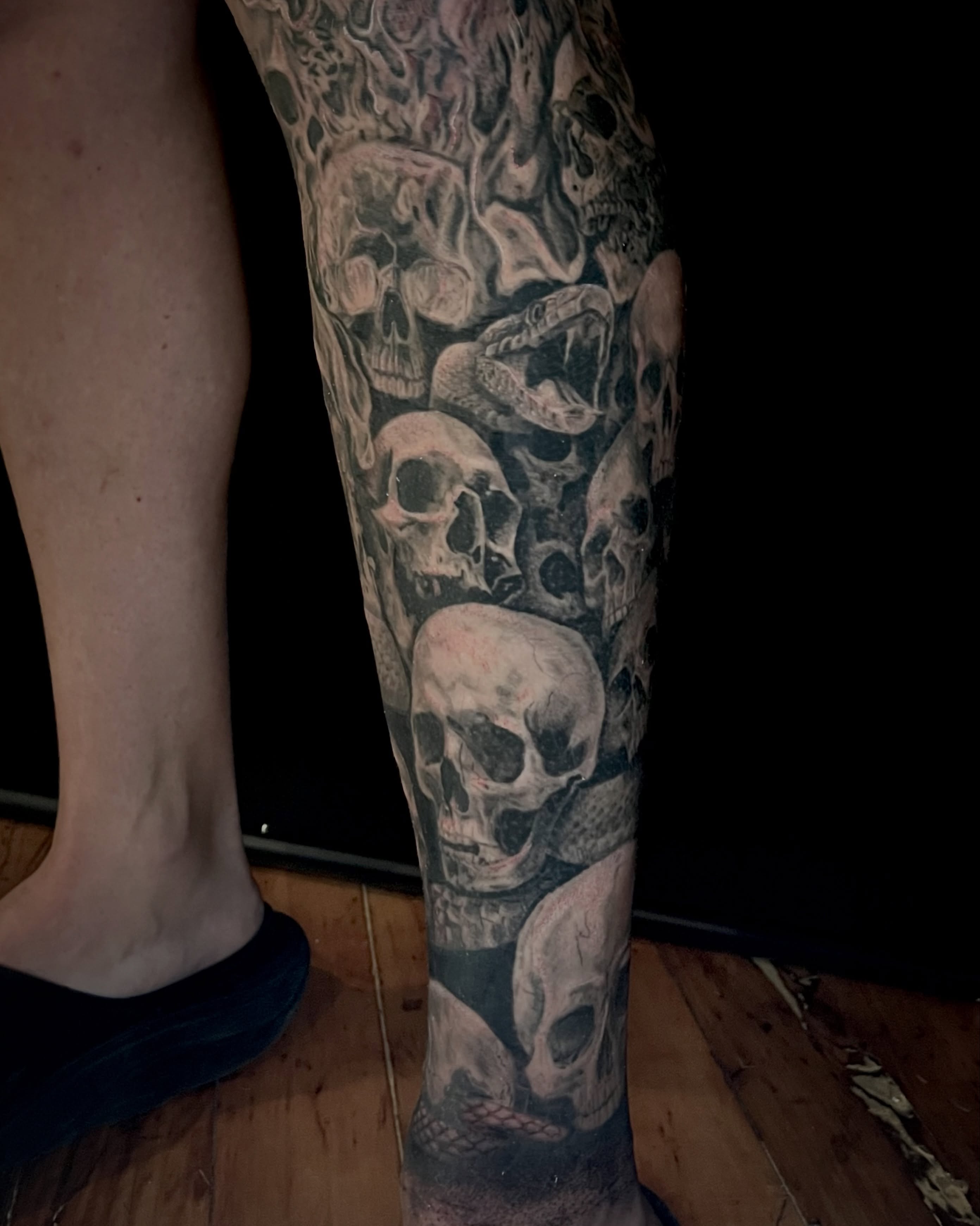 Skulls realism tattoo on the calf by EO, Chicago, Illinois