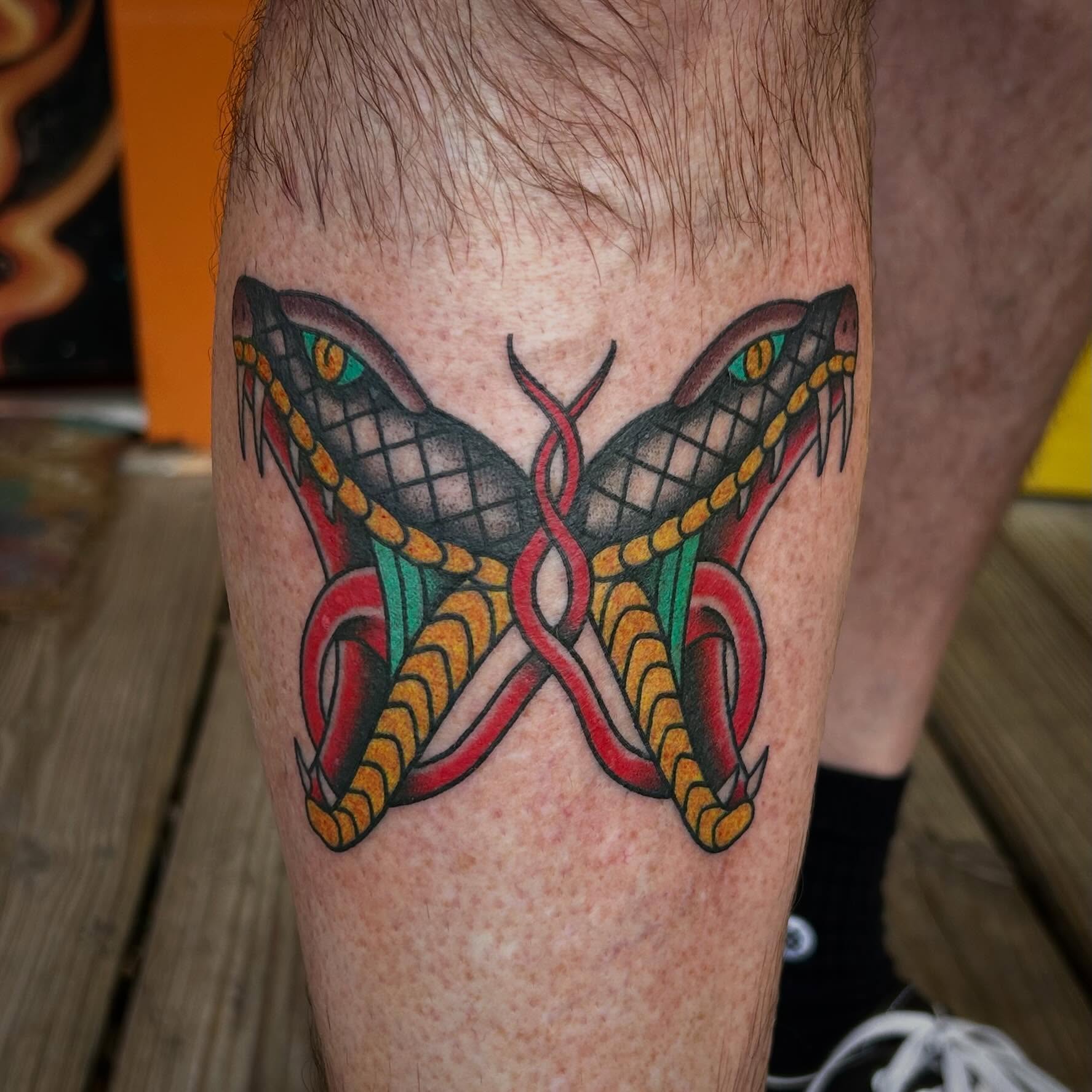 Snakes American traditional tattoo on the leg by Blake Chambers