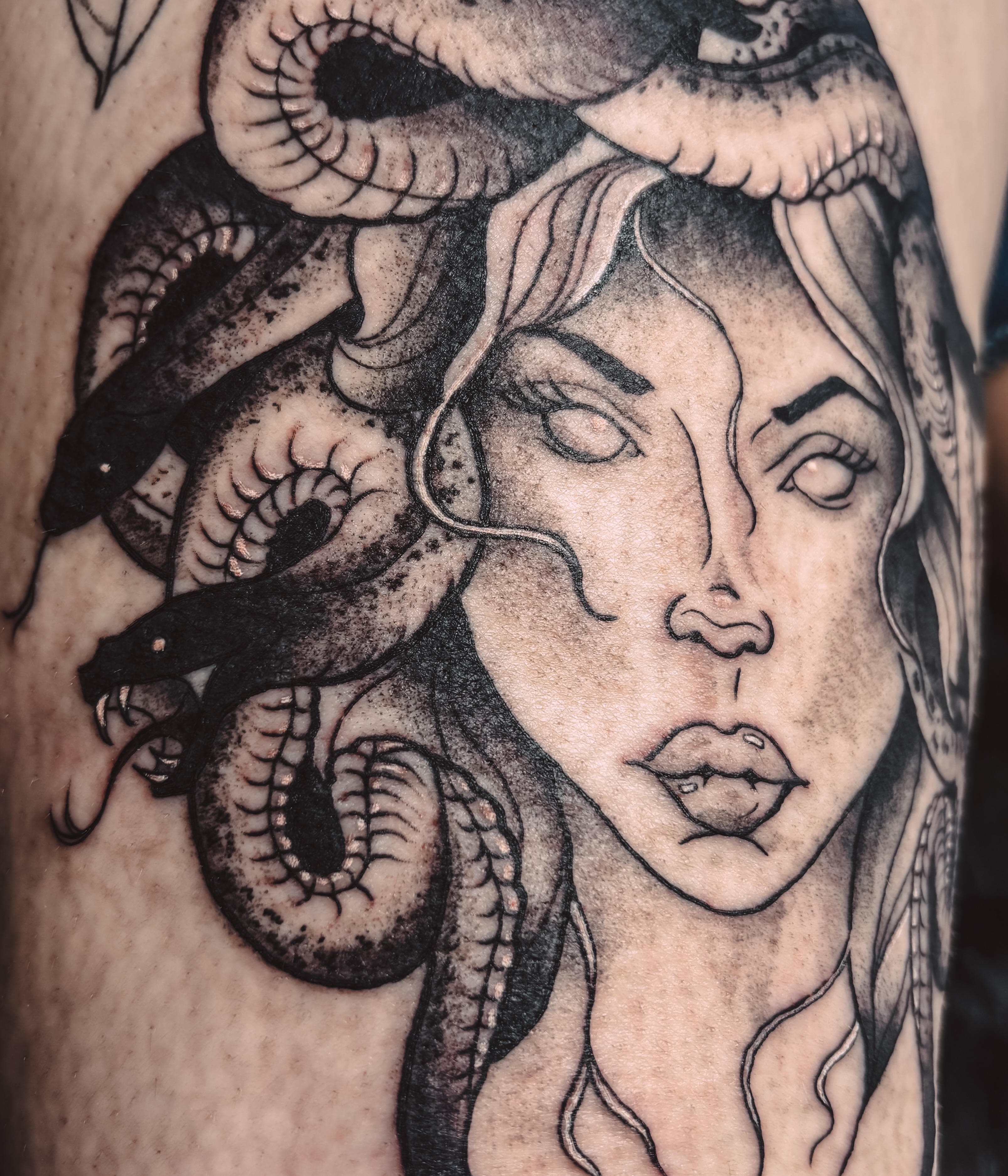 Medusa realism tattoo on the forearm by Liz Cook