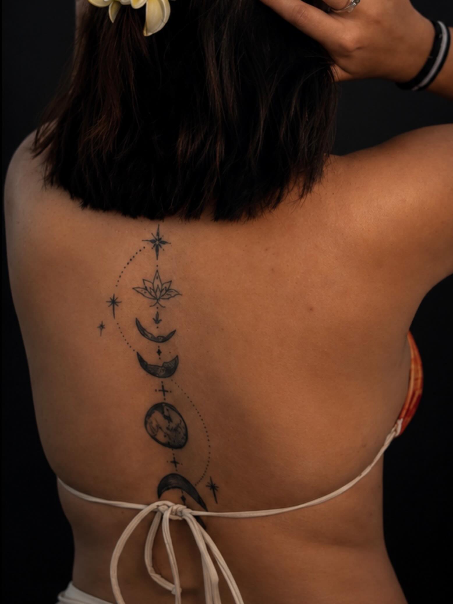 Moon phases and lotus dotwork tattoo on the back by Montero Ink™