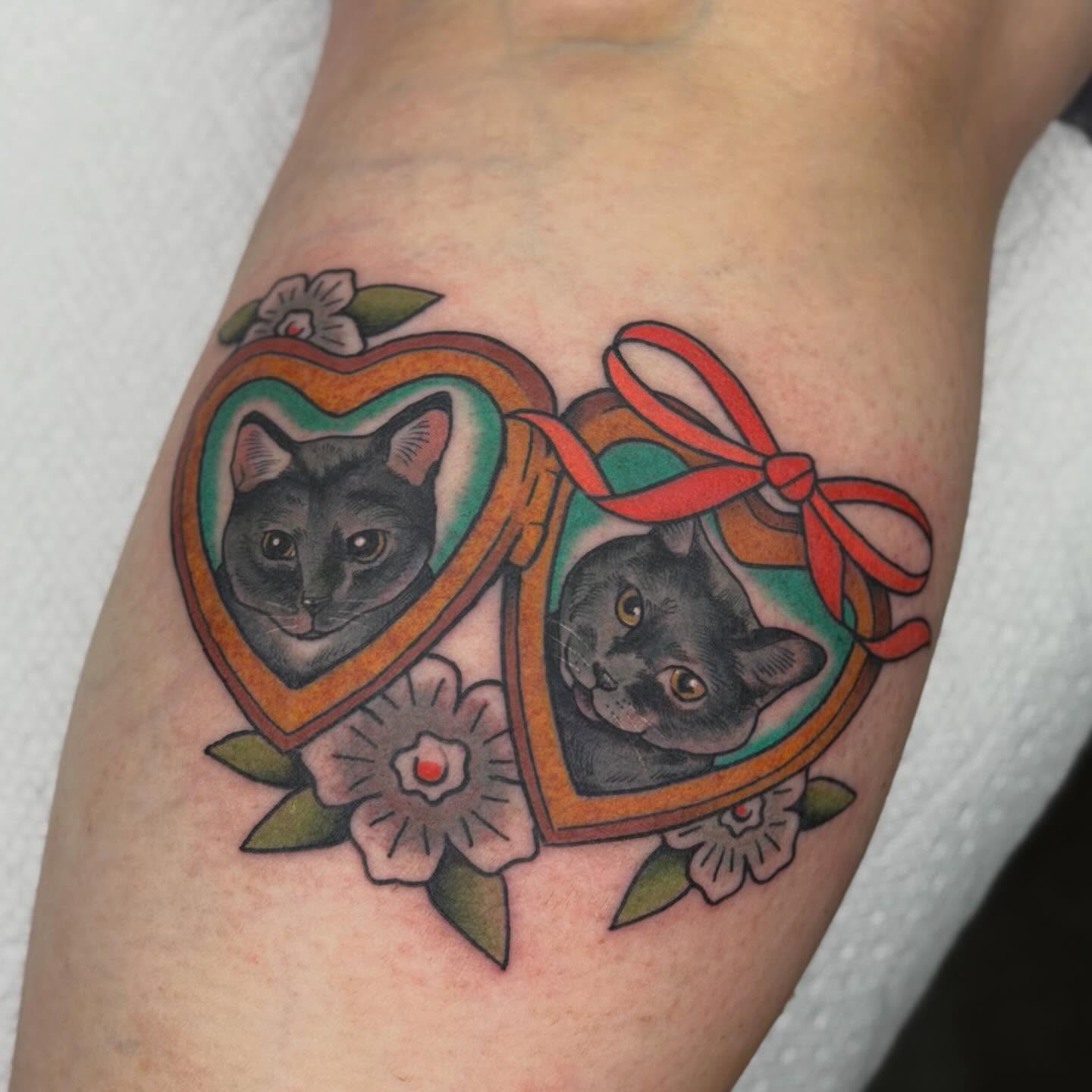 Cat portraits American traditional tattoo on the forearm by Jenna Szerszen-Wynn ๐