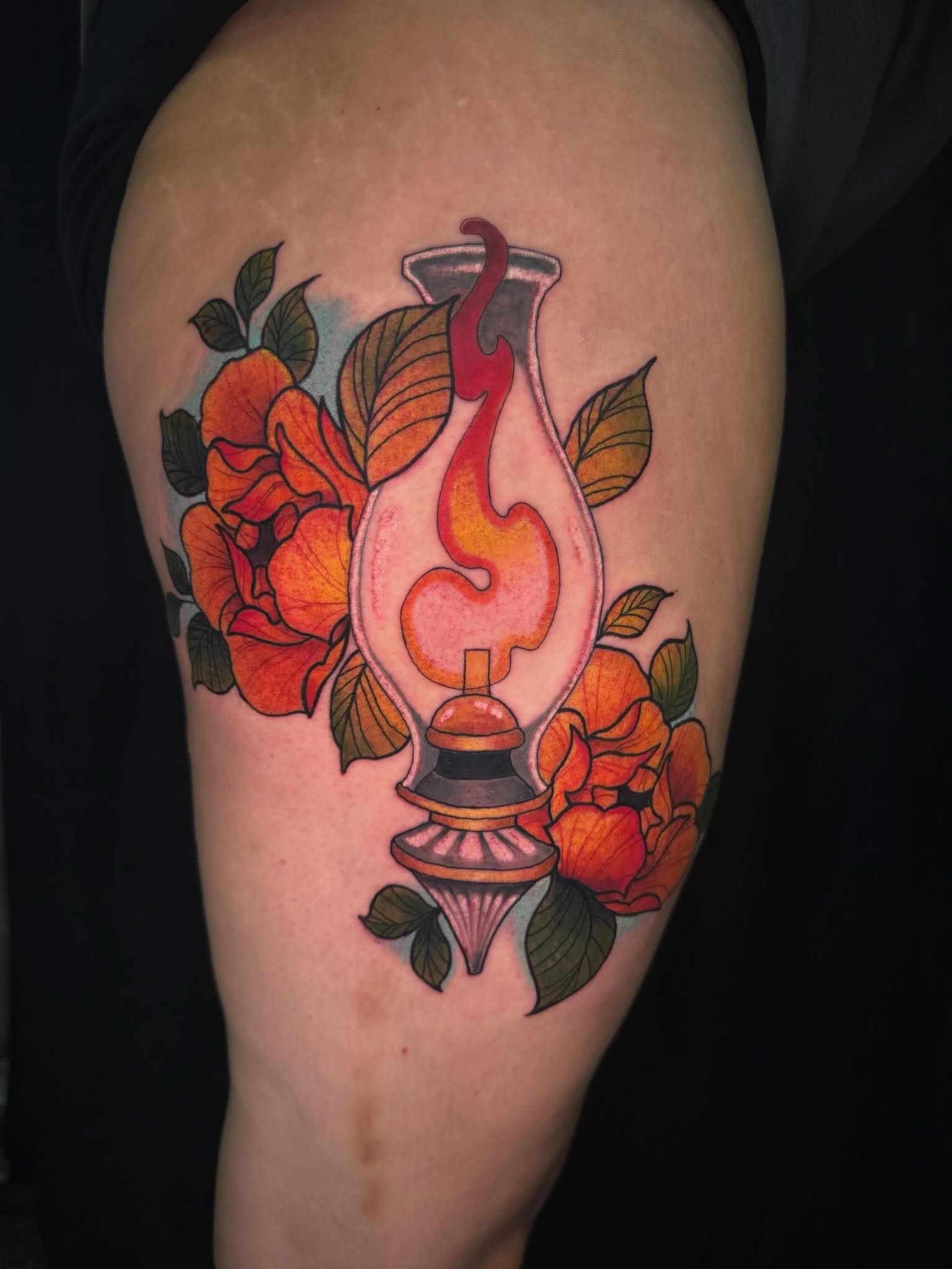 Oil lamp with flames American traditional tattoo on the thigh by Taylor Steckman