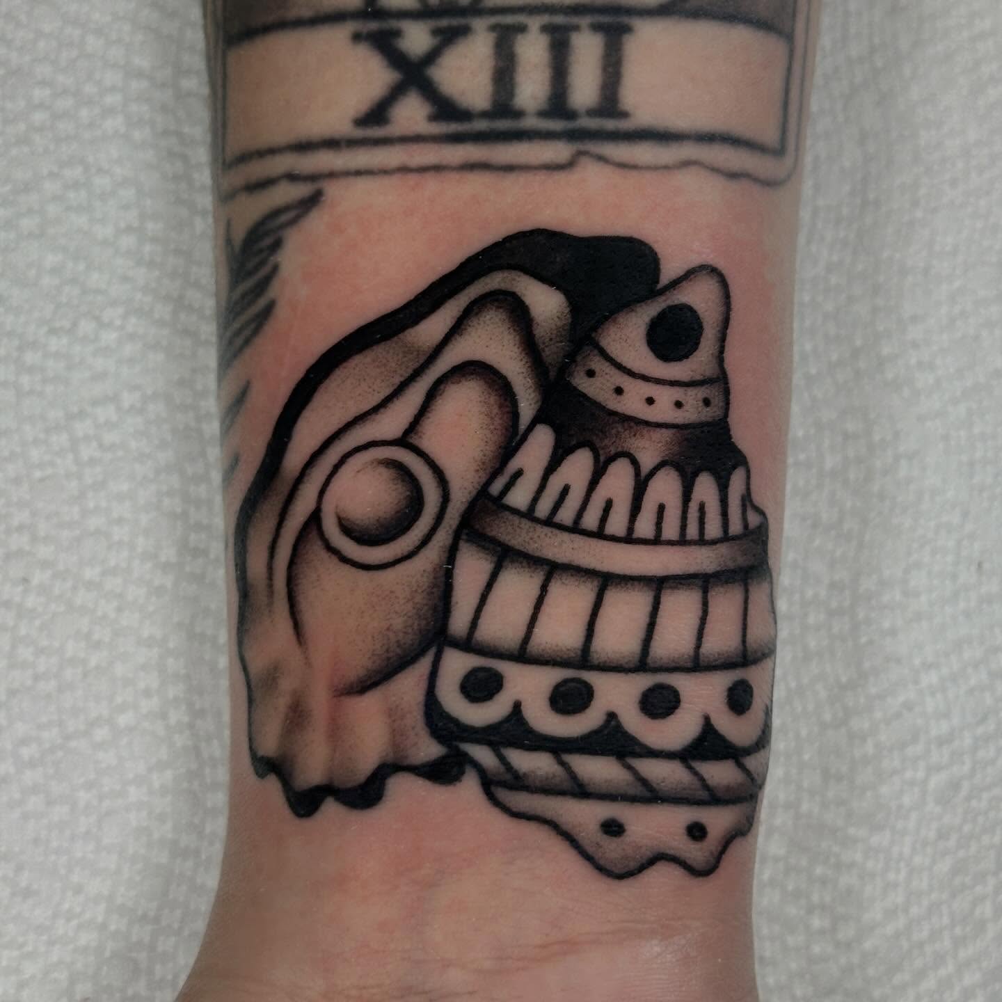 Skull black and grey tattoo on the forearm by Kyle Logan Frary