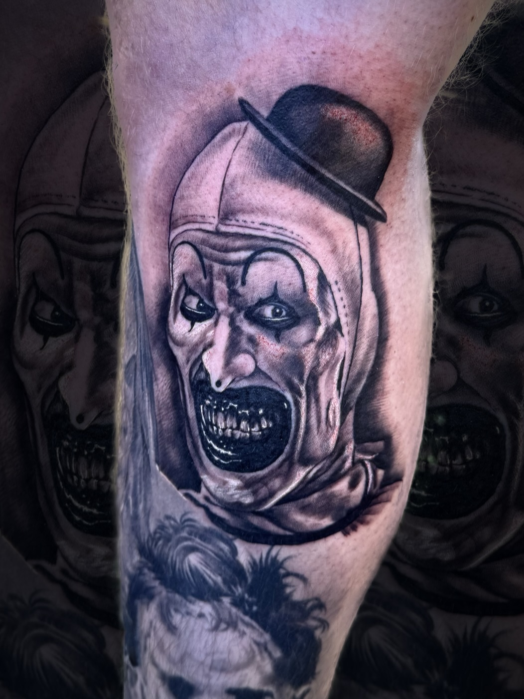 Creepy clown portrait realism tattoo on the forearm by Nick Harrison, Dayton, Ohio