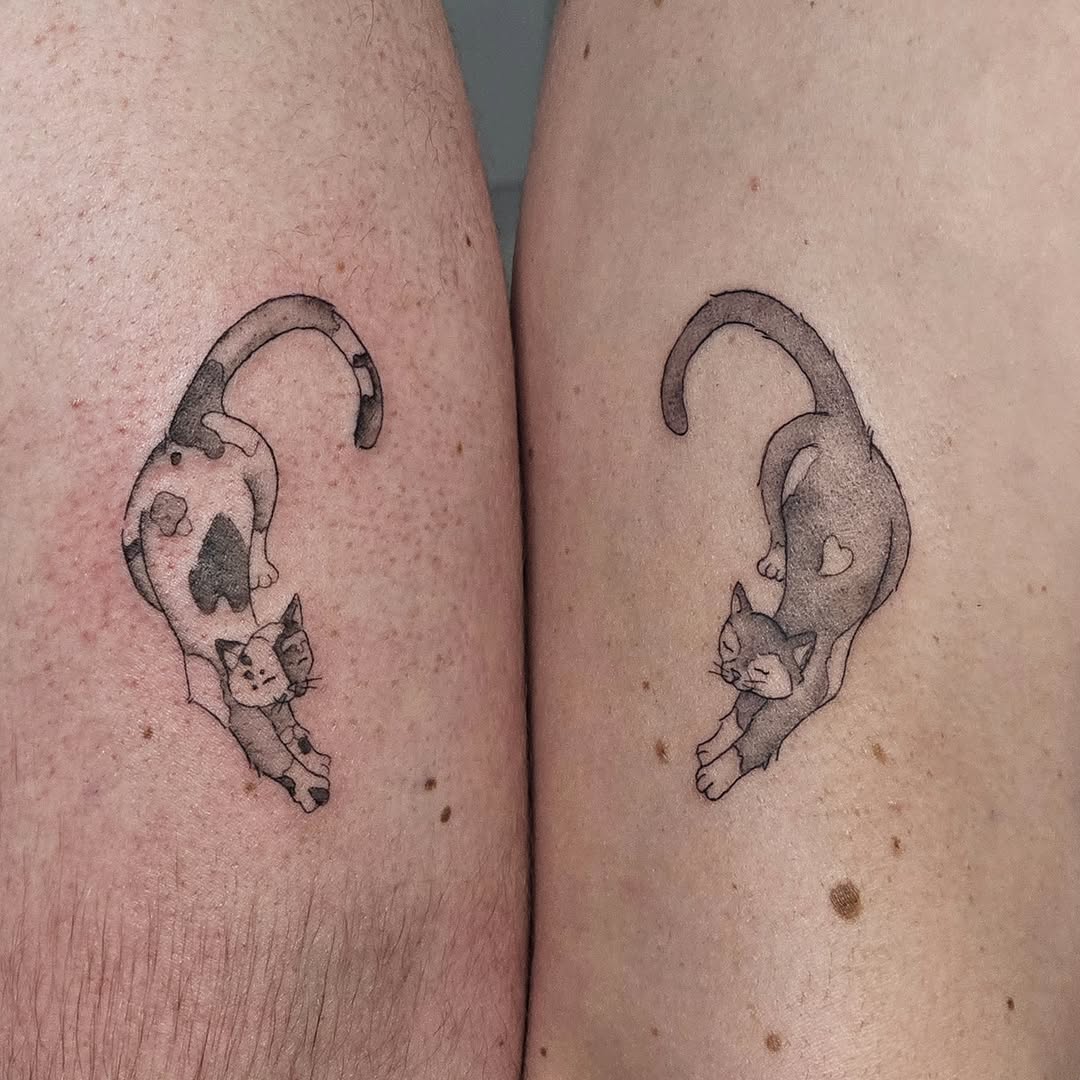 Cat black and grey tattoo on the leg by Casey Jo
