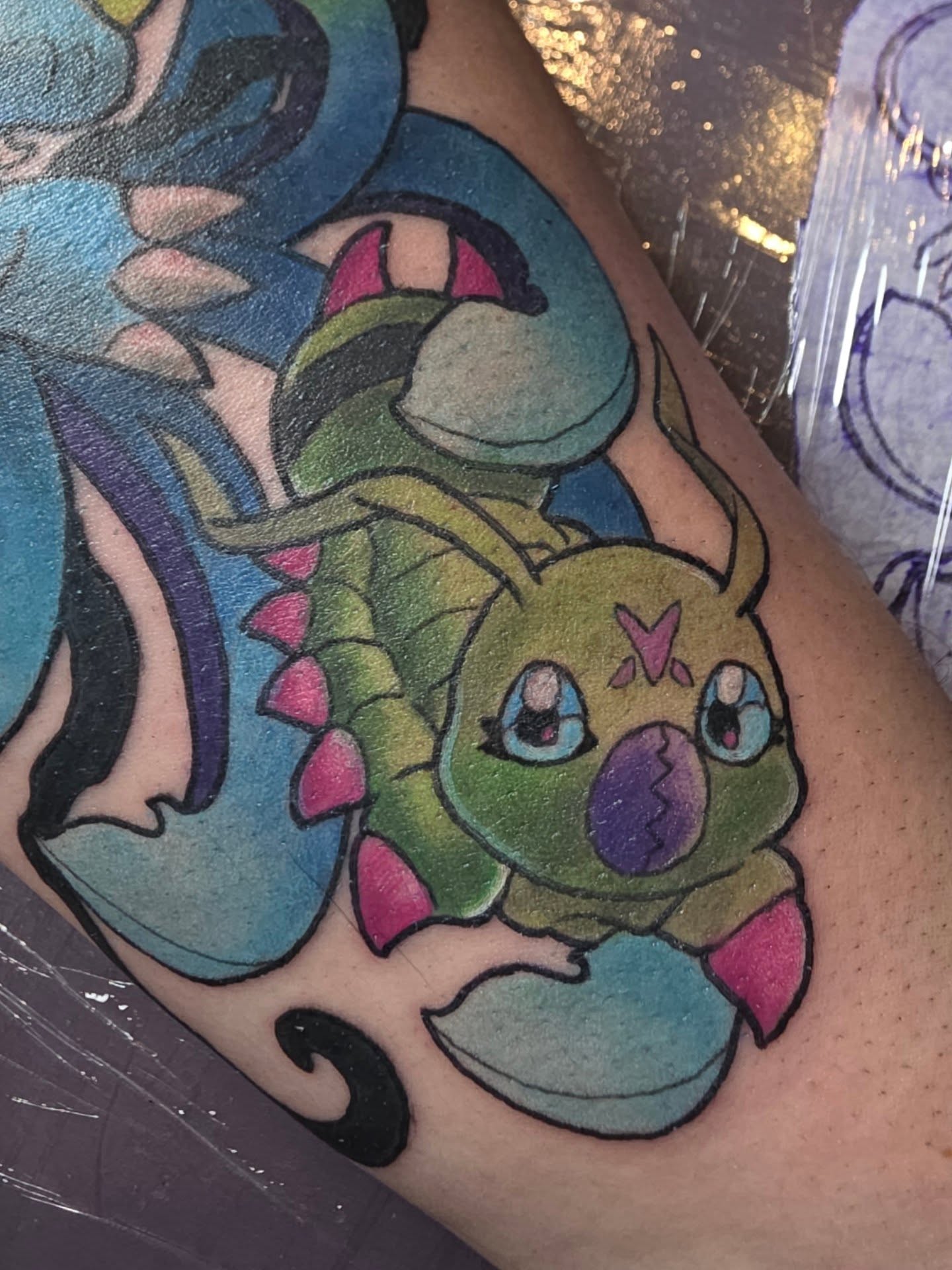 Dragon new school tattoo on the forearm by Kayla Williams