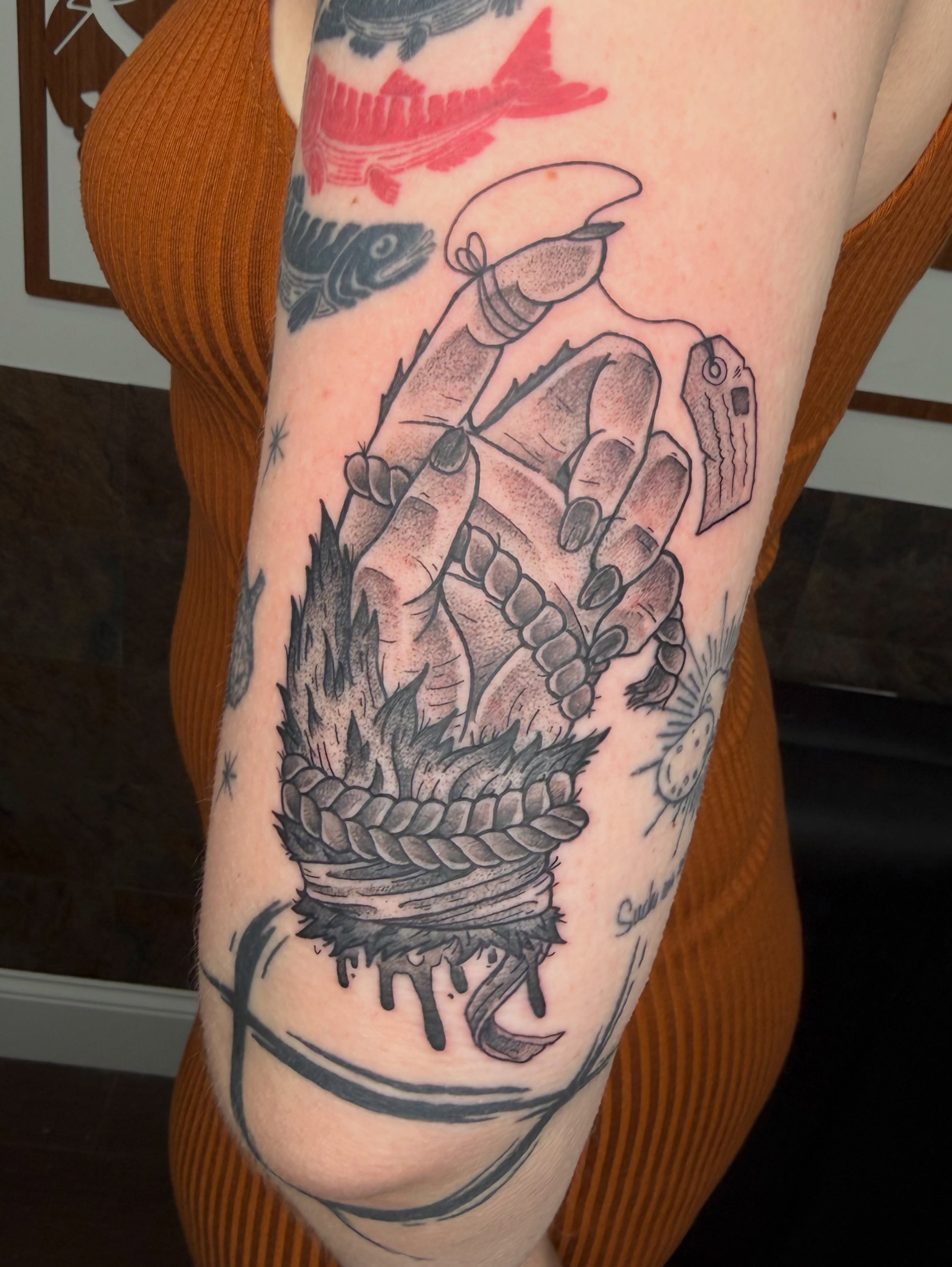 Hand with rope American traditional tattoo on the forearm by Jezza Munson