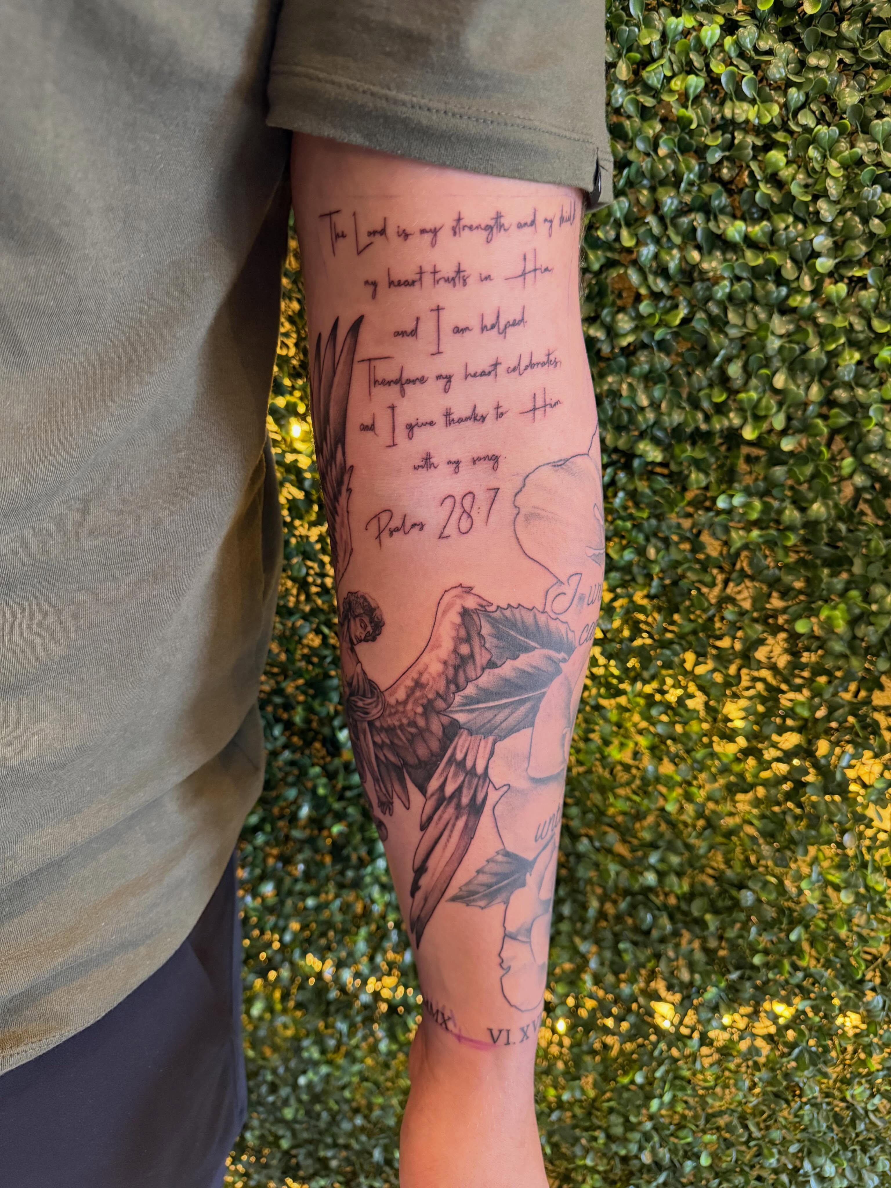 Angel with wings black and grey tattoo on the forearm by Lauren Horness