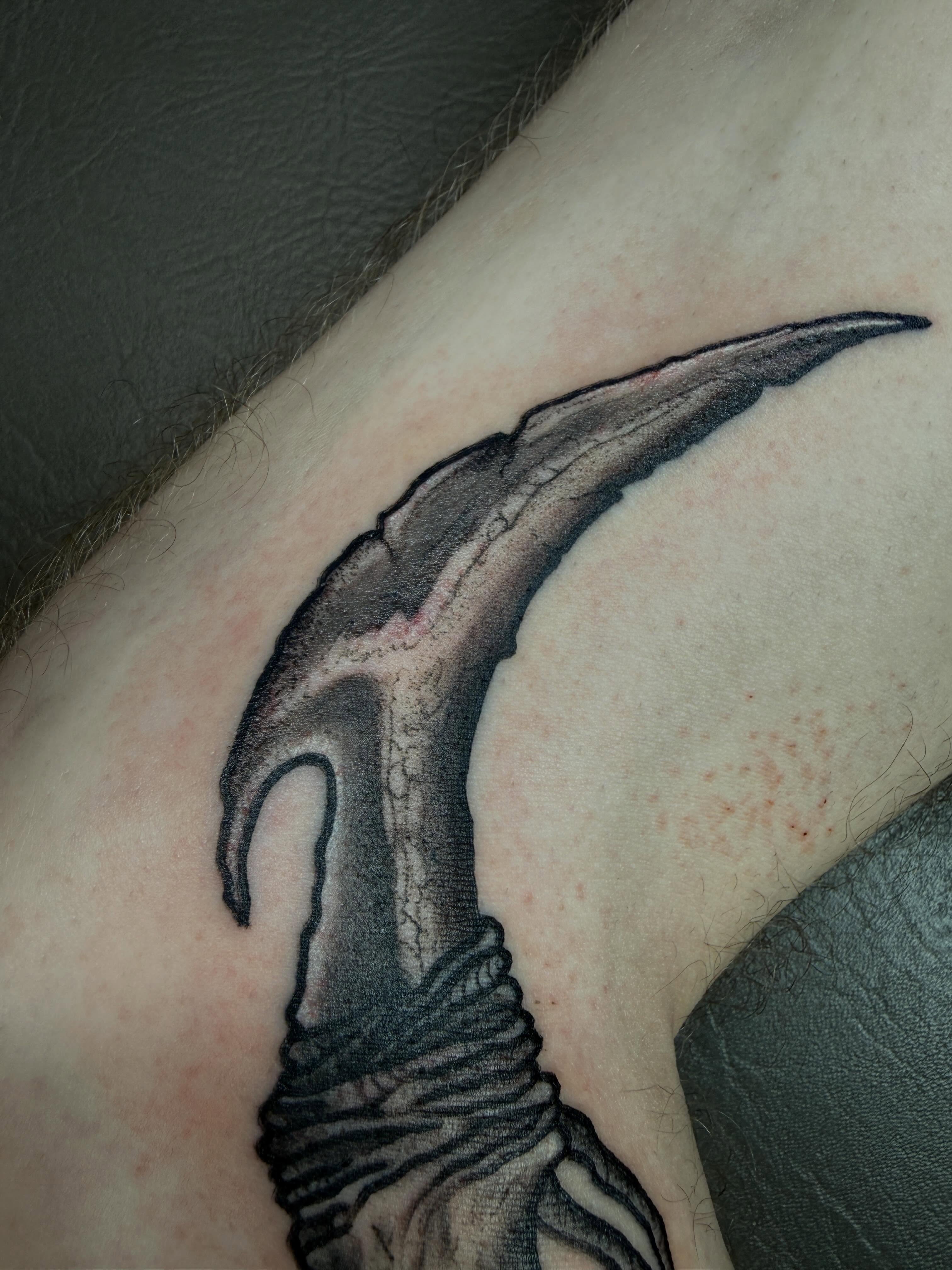 Scythe black and grey tattoo on the forearm by sᴋᴇᴛᴄʜᴇᴅ