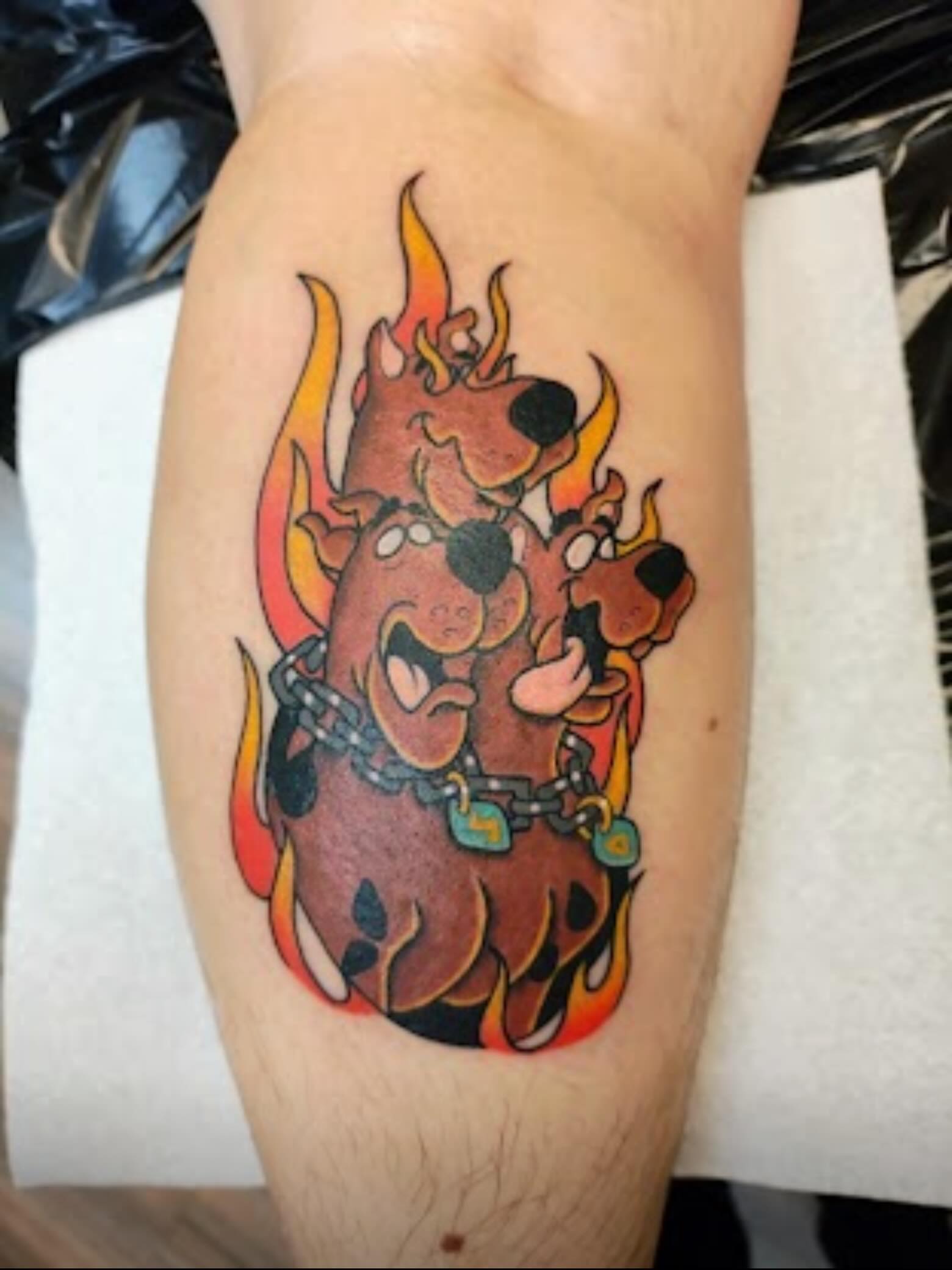 Scooby-Doo American traditional tattoo on the forearm by Danielle Lorandeau
