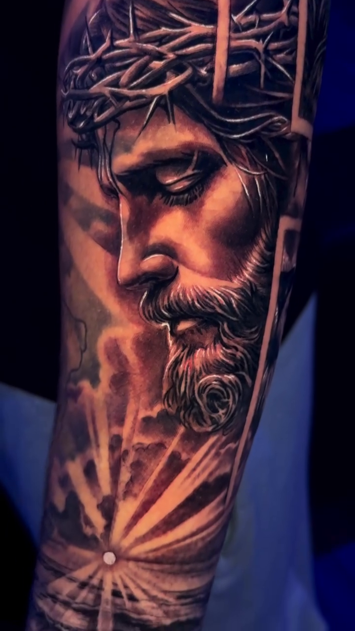 Jesus Christ and a lion realism tattoo on the forearm by Raw Hound, Hialeah, Florida