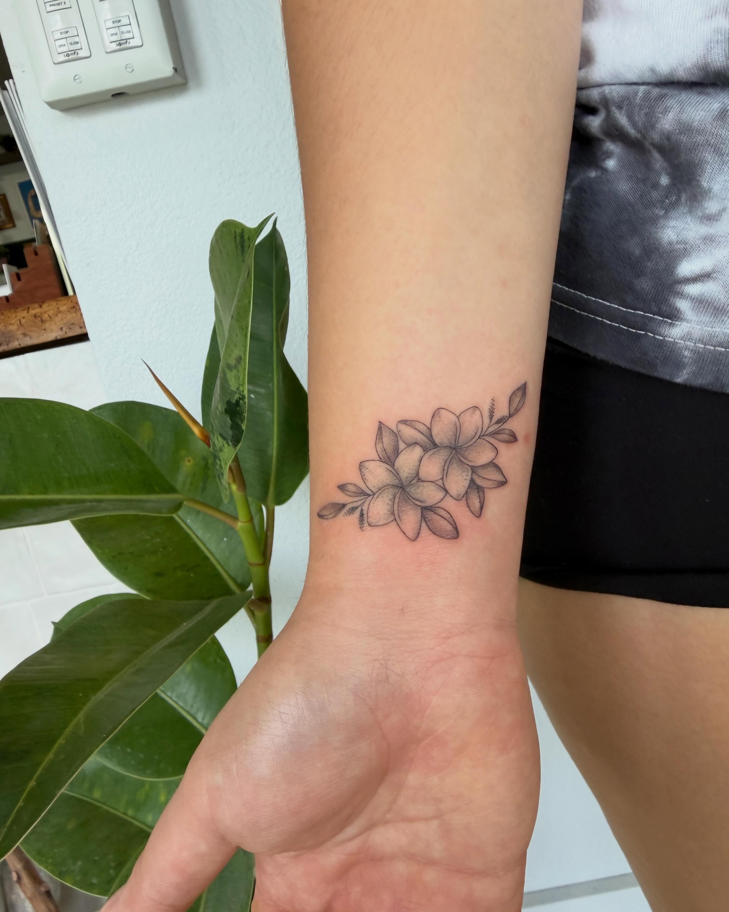 Flower arrangement black and grey tattoo on the forearm by Priscila - HAWAII TATTOO