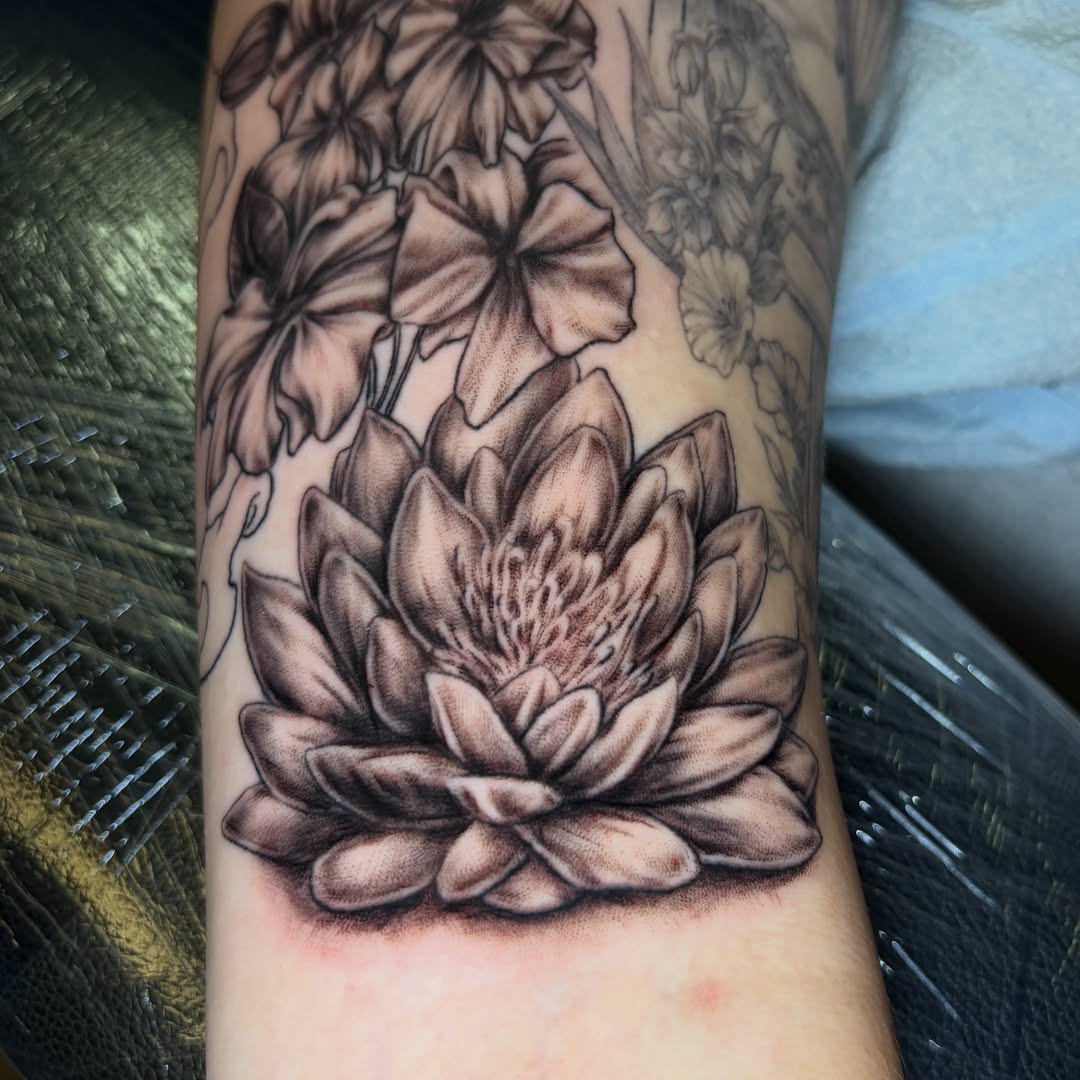 Lotus flower realism tattoo on the forearm by Ali Stanley, Virginia Beach, Virginia