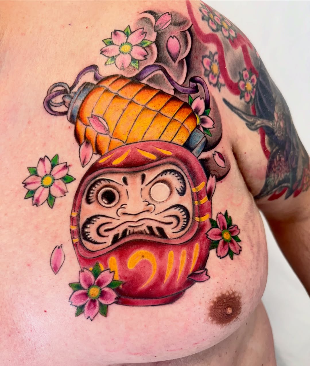Daruma doll japanese irezumi tattoo on the shoulder by Jerry Thomas