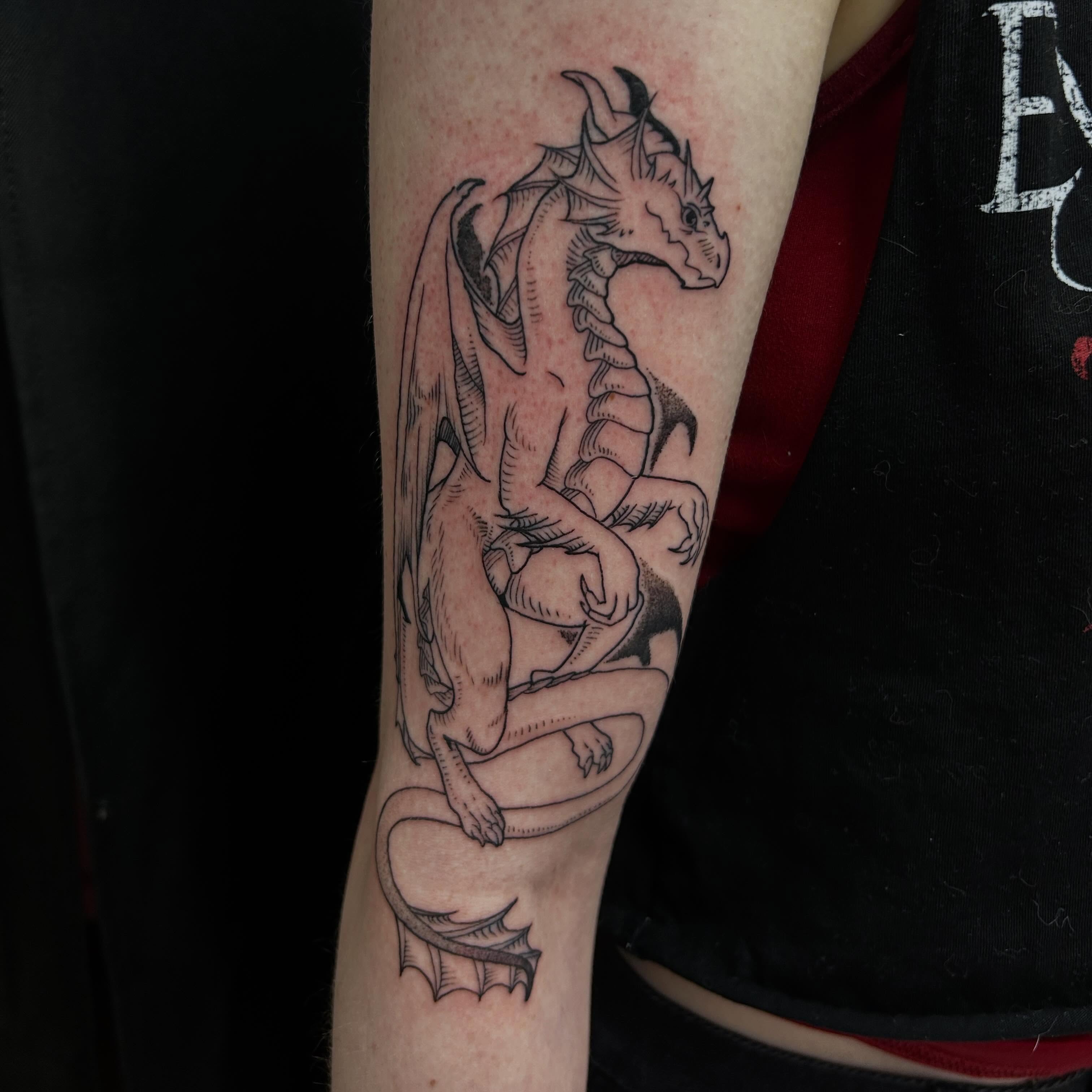 Dragon black and grey tattoo on the forearm by Tim Wilson