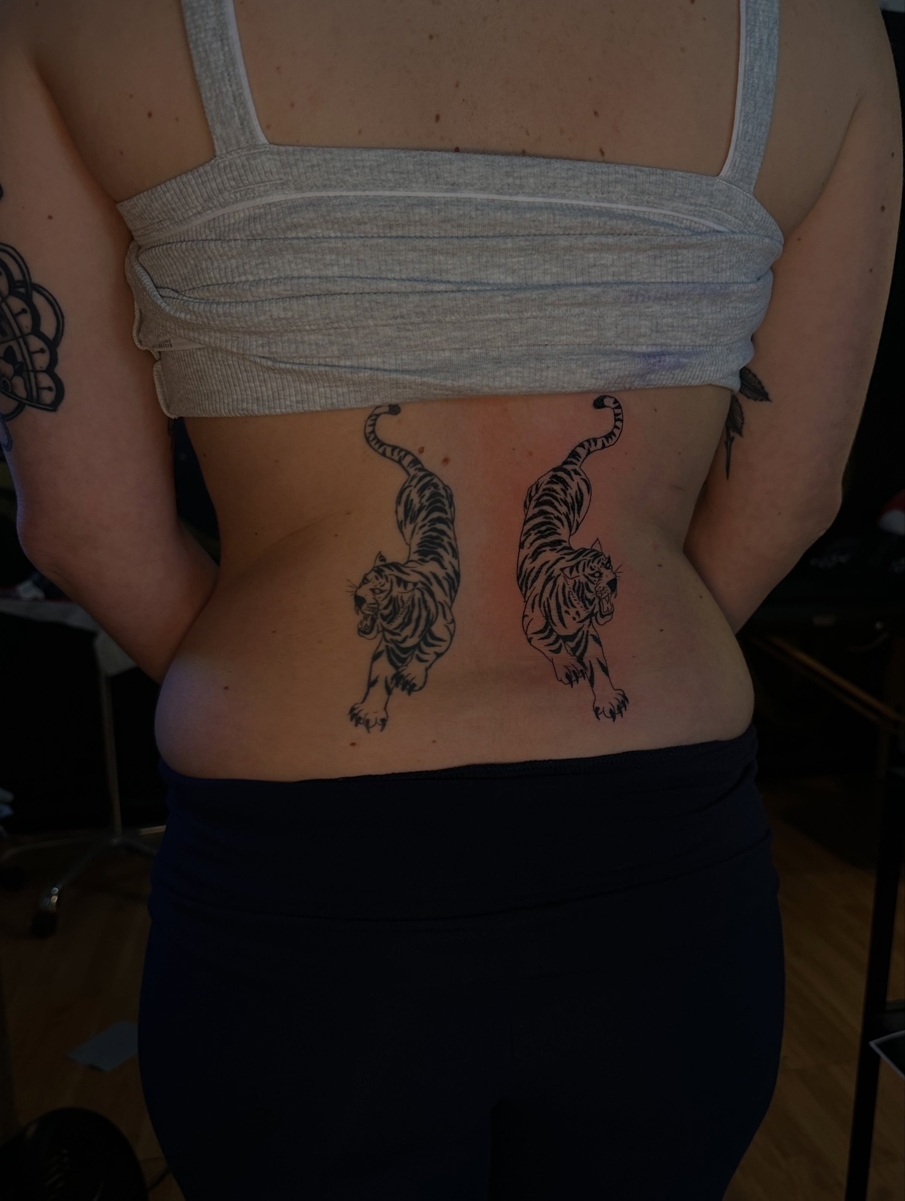 Tigers black and grey tattoo on the torso by Yassin alsaje