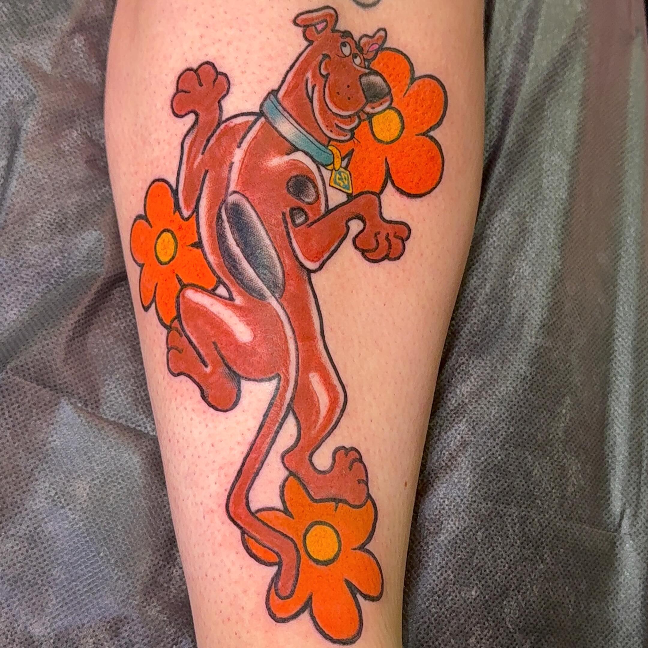 Scooby-doo new school tattoo on the forearm by Erin McDavis