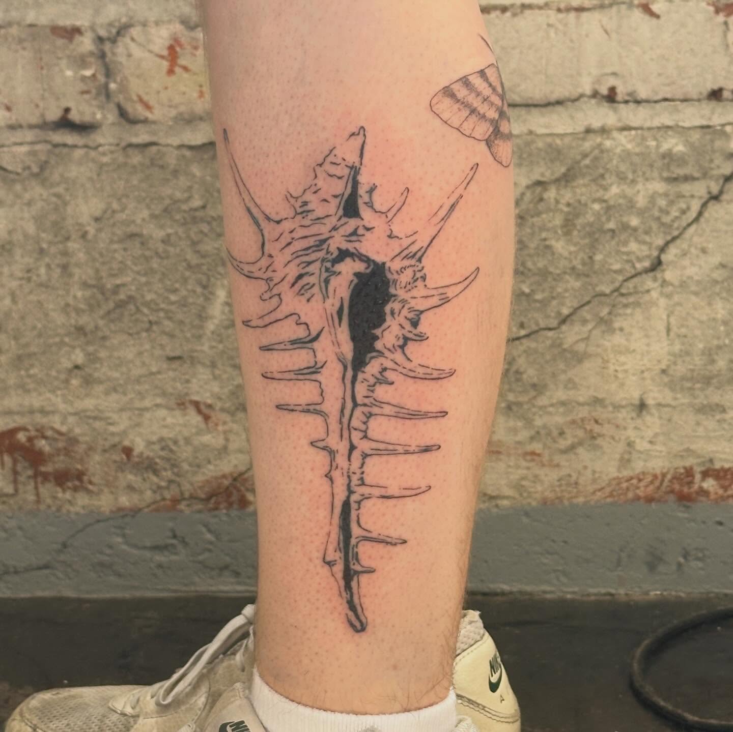 Spine black and grey tattoo on the calf by Jules🕯️