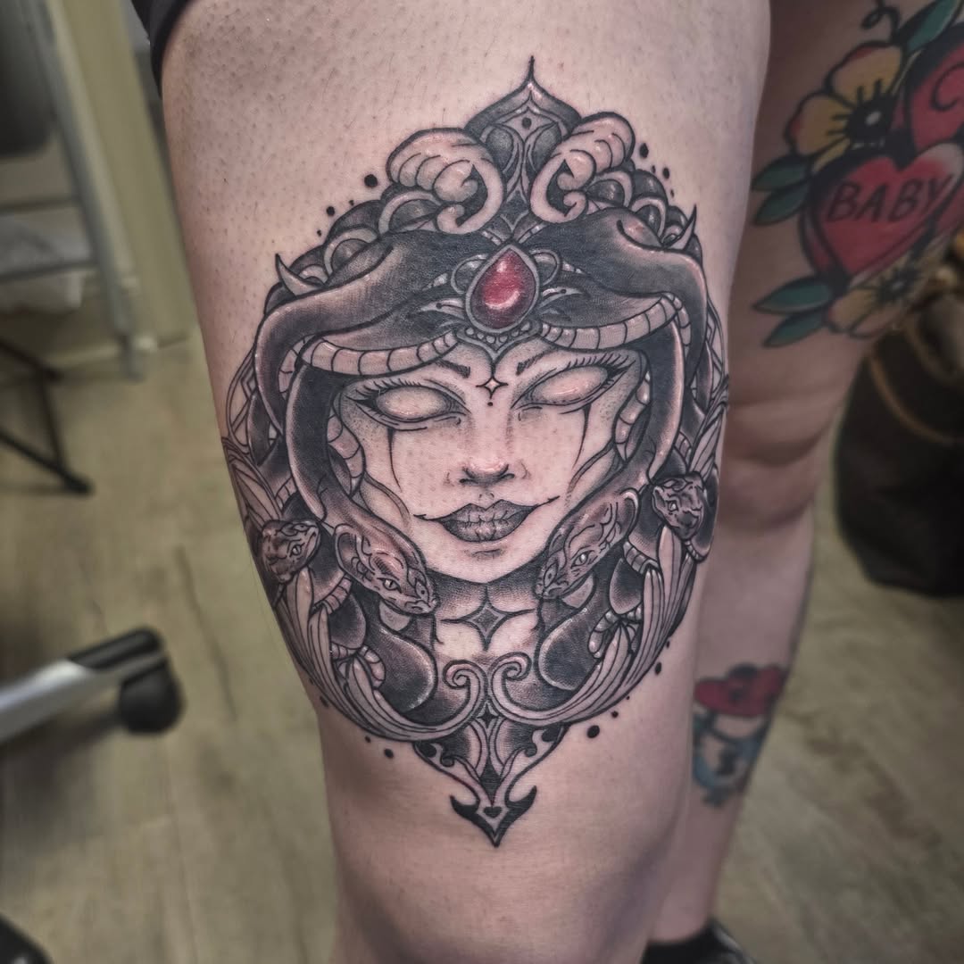Snake and woman geometric tattoo on the thigh by Val Sanchez